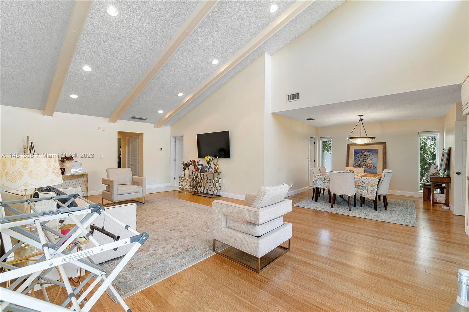 6157 Old Court Road, Unit 225 Boca Raton, FL 33433 - Photo 6 of 27 a living room with furniture and a flat screen tv