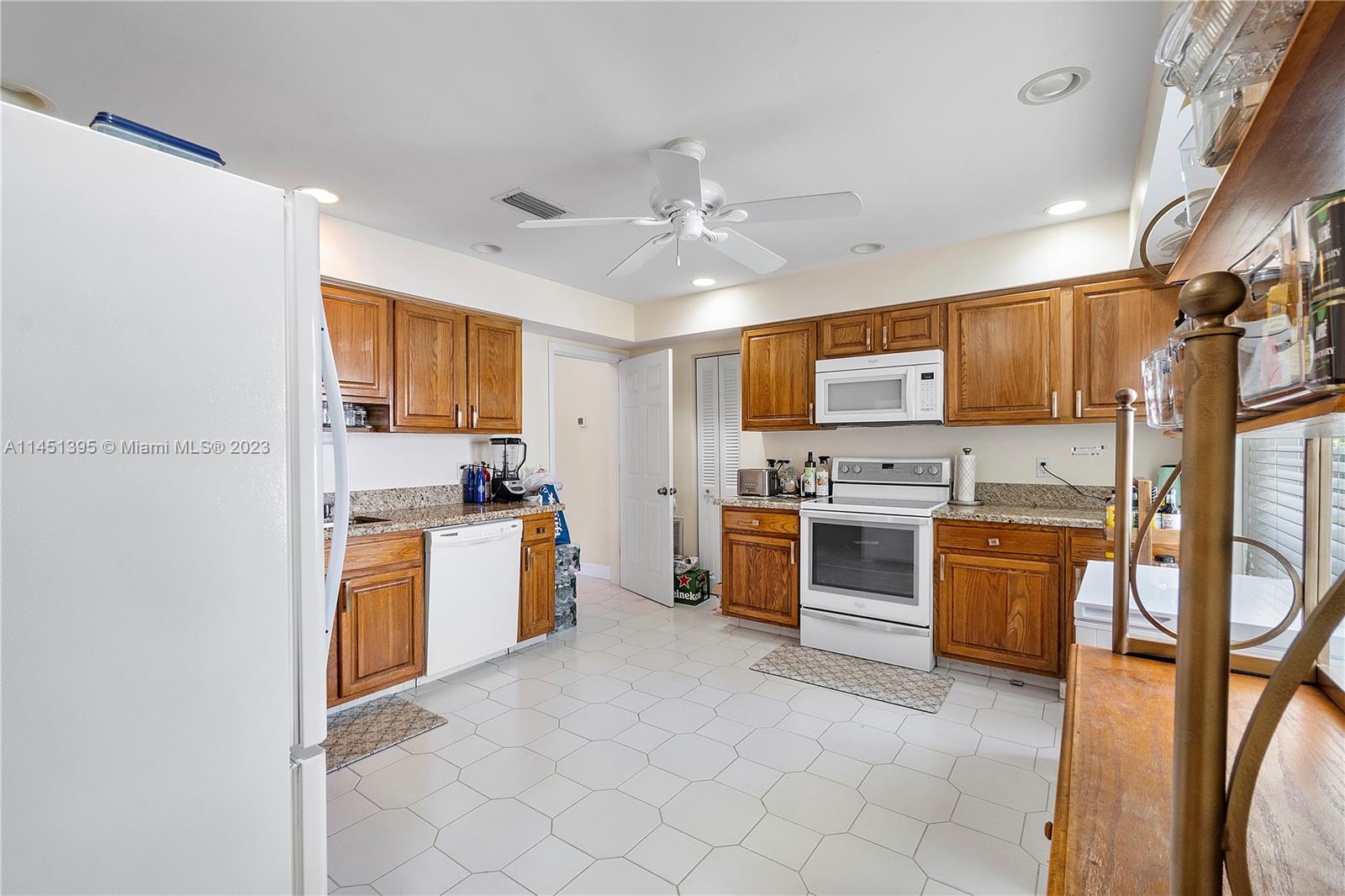 6157 Old Court Road, Unit 225 Boca Raton, FL 33433 - Photo 9 of 27 a kitchen with stainless steel appliances granite countertop a stove refrigerator sink and dishwasher