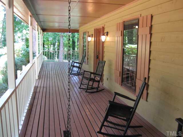 8316 Wheatstone Lane Raleigh, NC 27613 - Photo 6 of 22 Who wouldn't enjoy this wrap around front porch?