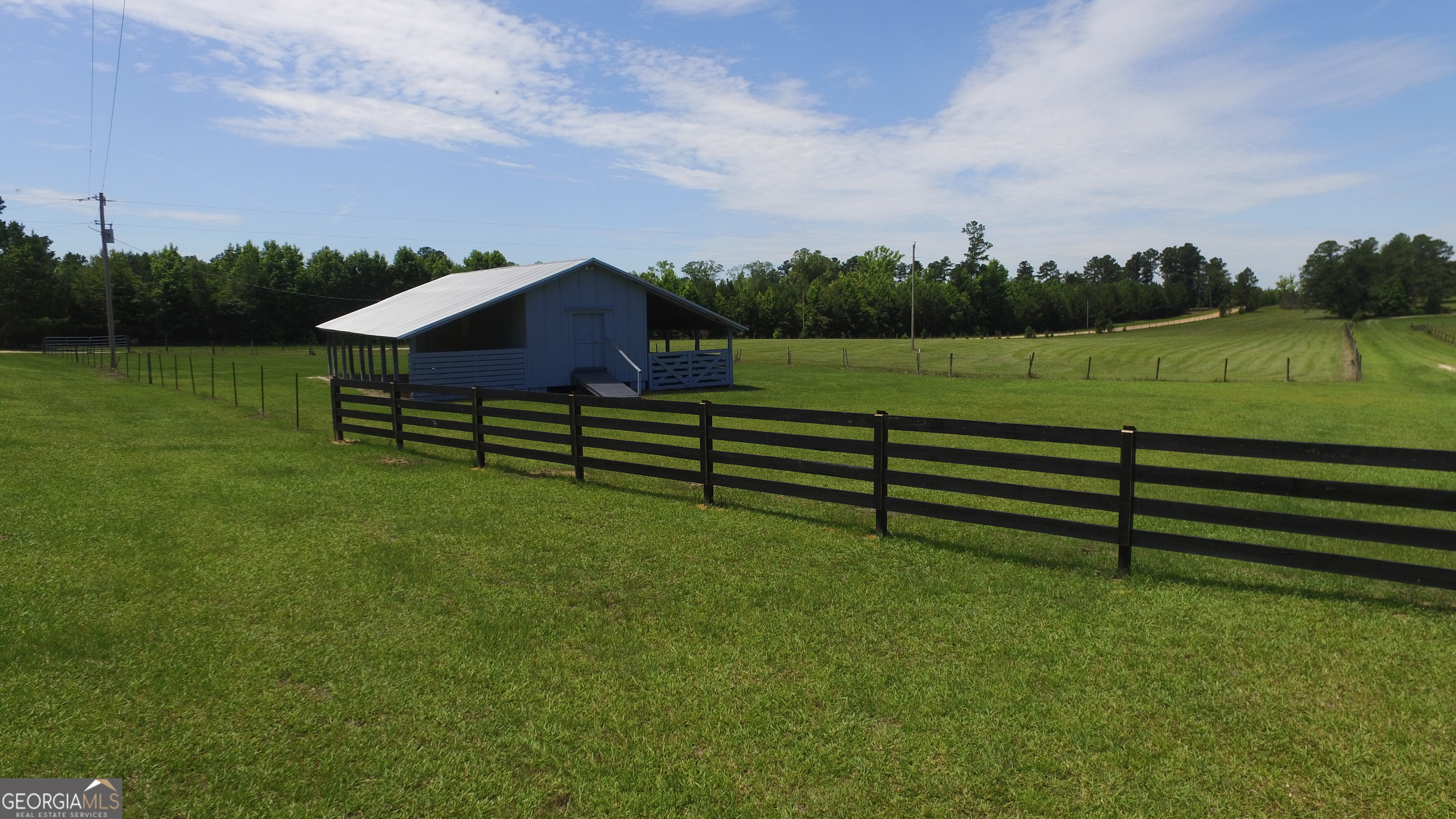 0 Ben Grady Collins Road, Unit LOT 1 Statesboro, GA 30450 - Photo 4 of 6 a view of a bench in a grassy field