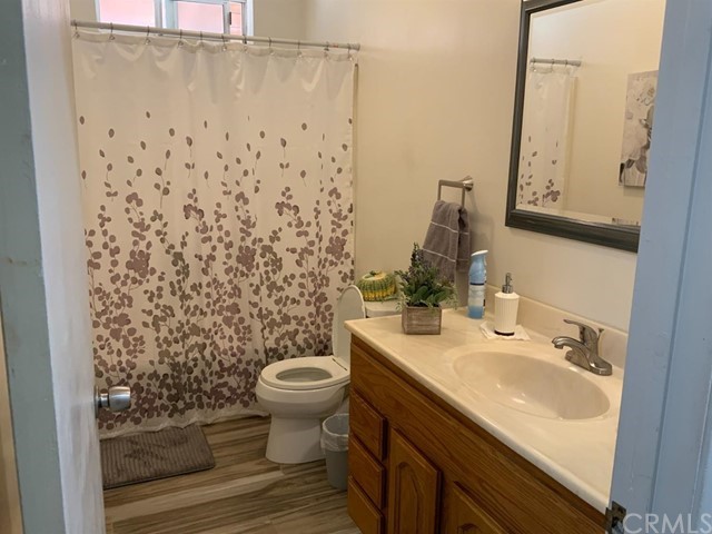 9450 Mango Avenue Hesperia, CA 92345 - Photo 9 of 14 a bathroom with a sink toilet and shower