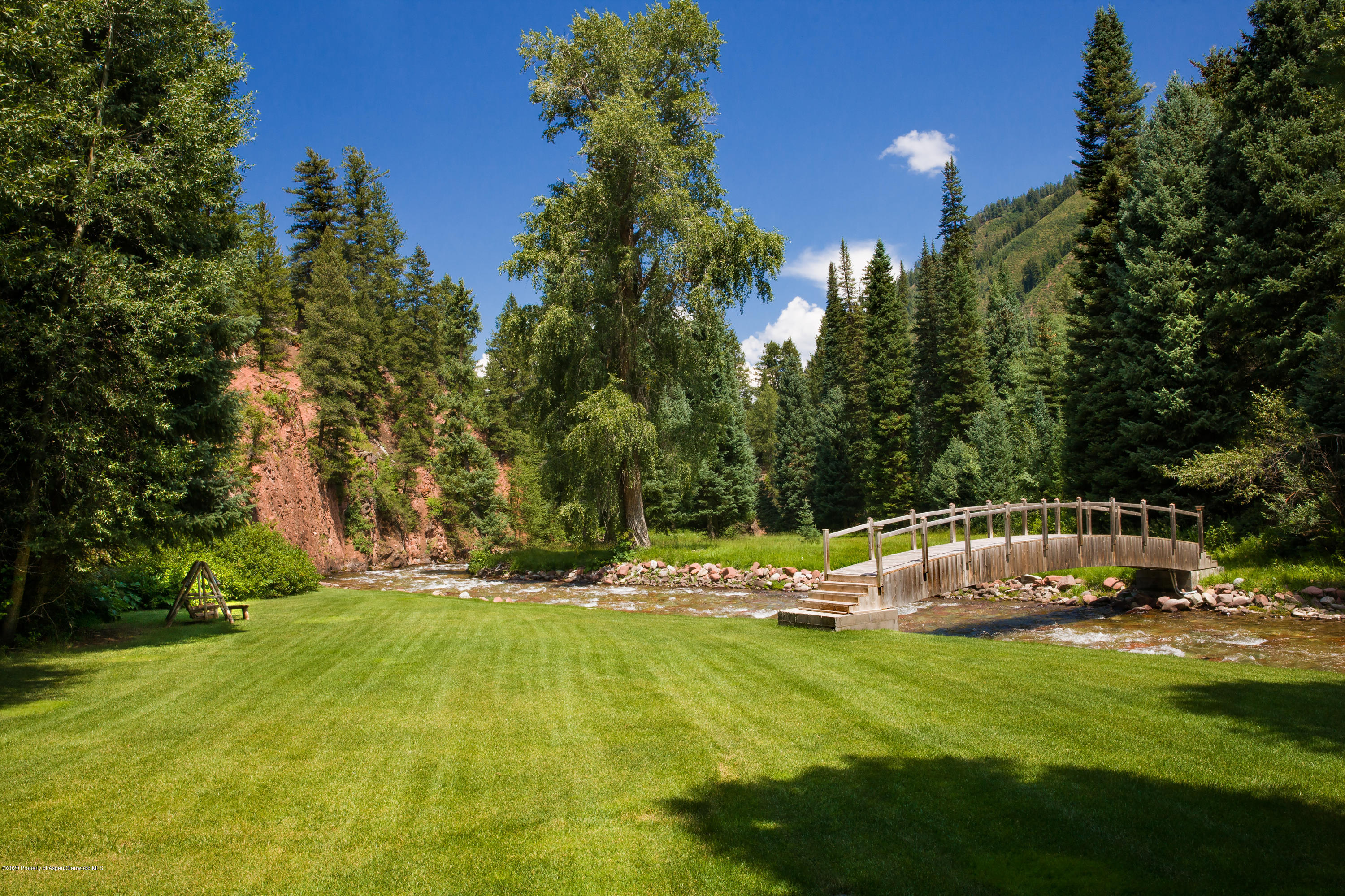 201 Midnight Mine Road Aspen, CO 81611 - Photo 11 of 40 a view of swimming pool and trees in the background