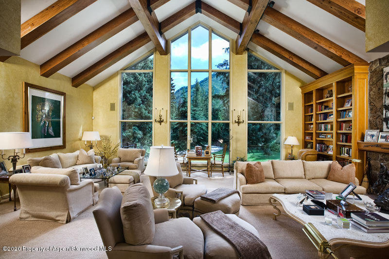 201 Midnight Mine Road Aspen, CO 81611 - Photo 21 of 40 a living room with furniture and floor to ceiling windows