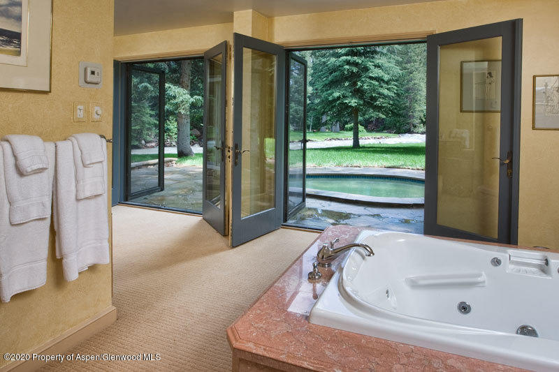 201 Midnight Mine Road Aspen, CO 81611 - Photo 25 of 40 a bathroom with a tub and sink