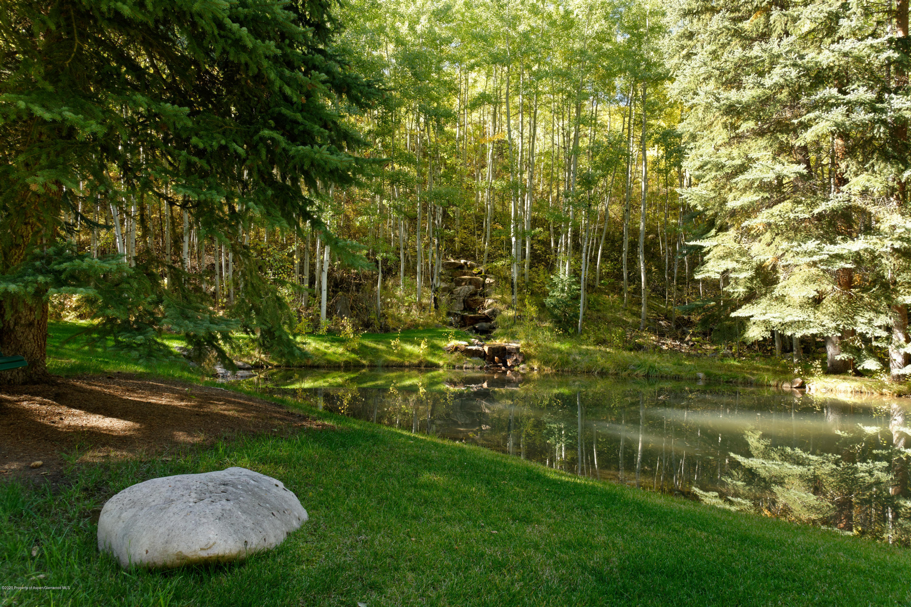 201 Midnight Mine Road Aspen, CO 81611 - Photo 3 of 40 a view of a golf course with a lake