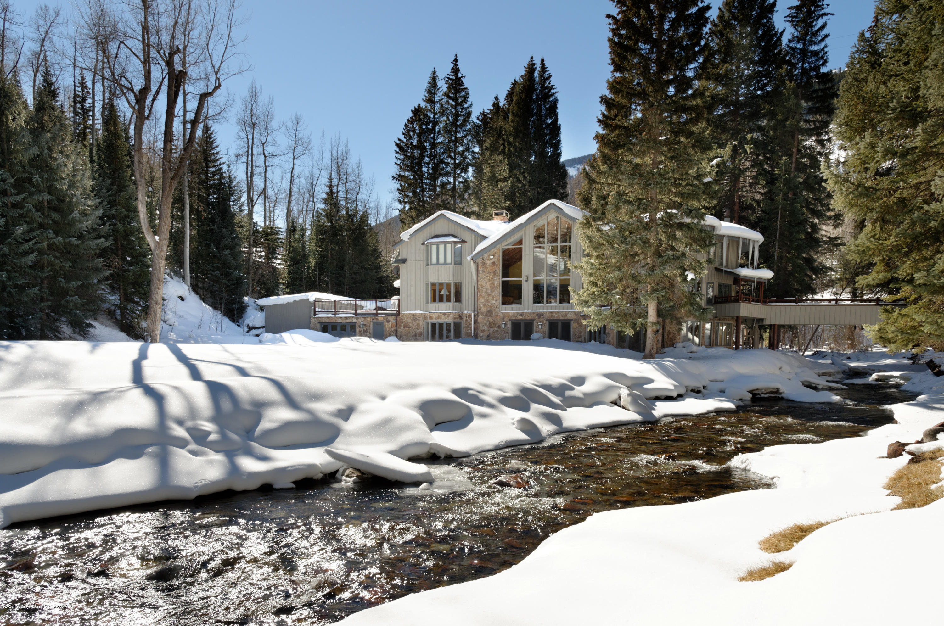 201 Midnight Mine Road Aspen, CO 81611 - Photo 34 of 40 a view of white house with a yard covered in snow