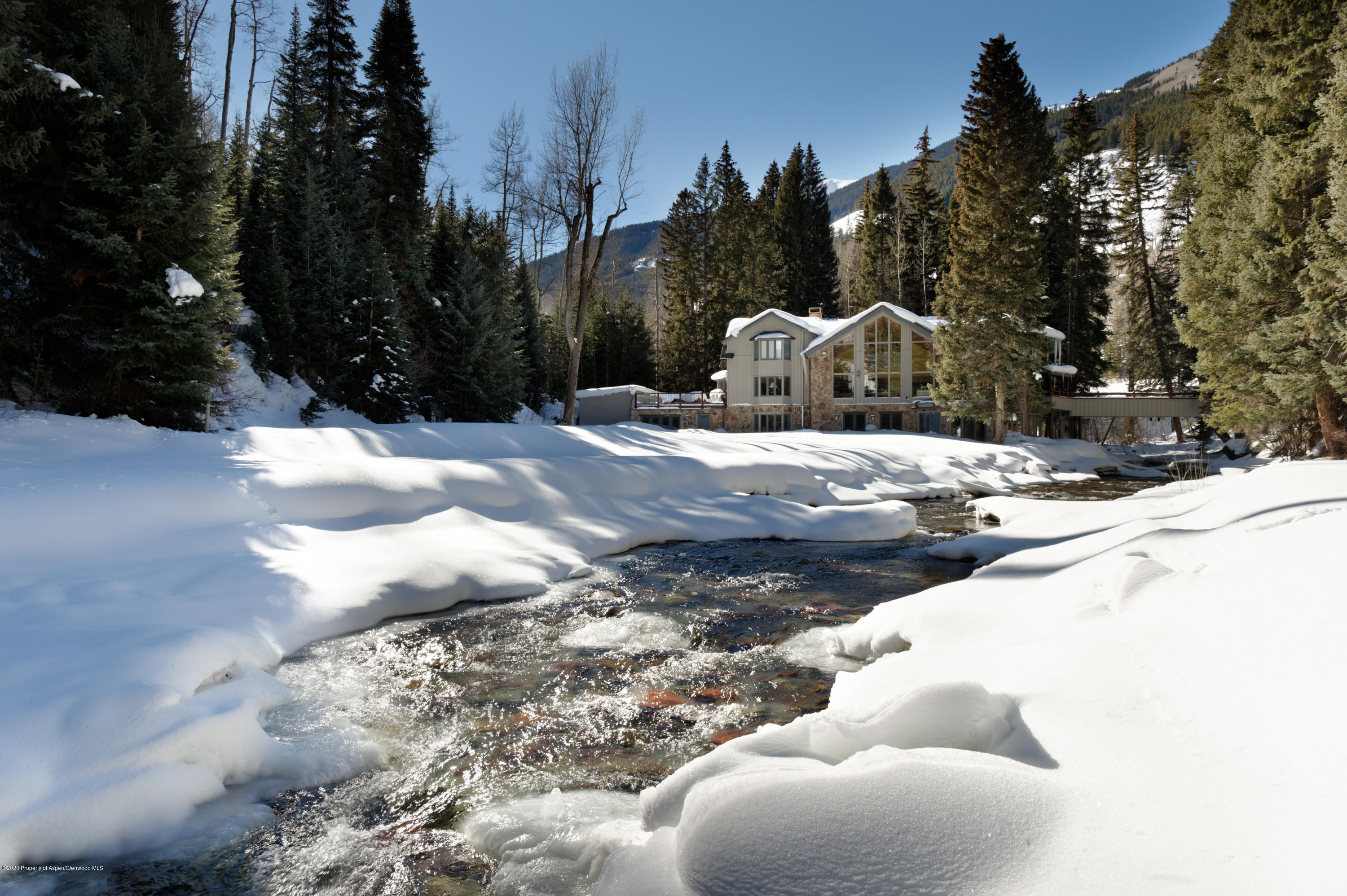 201 Midnight Mine Road Aspen, CO 81611 - Photo 40 of 40 a view of a white house with a yard covered in snow