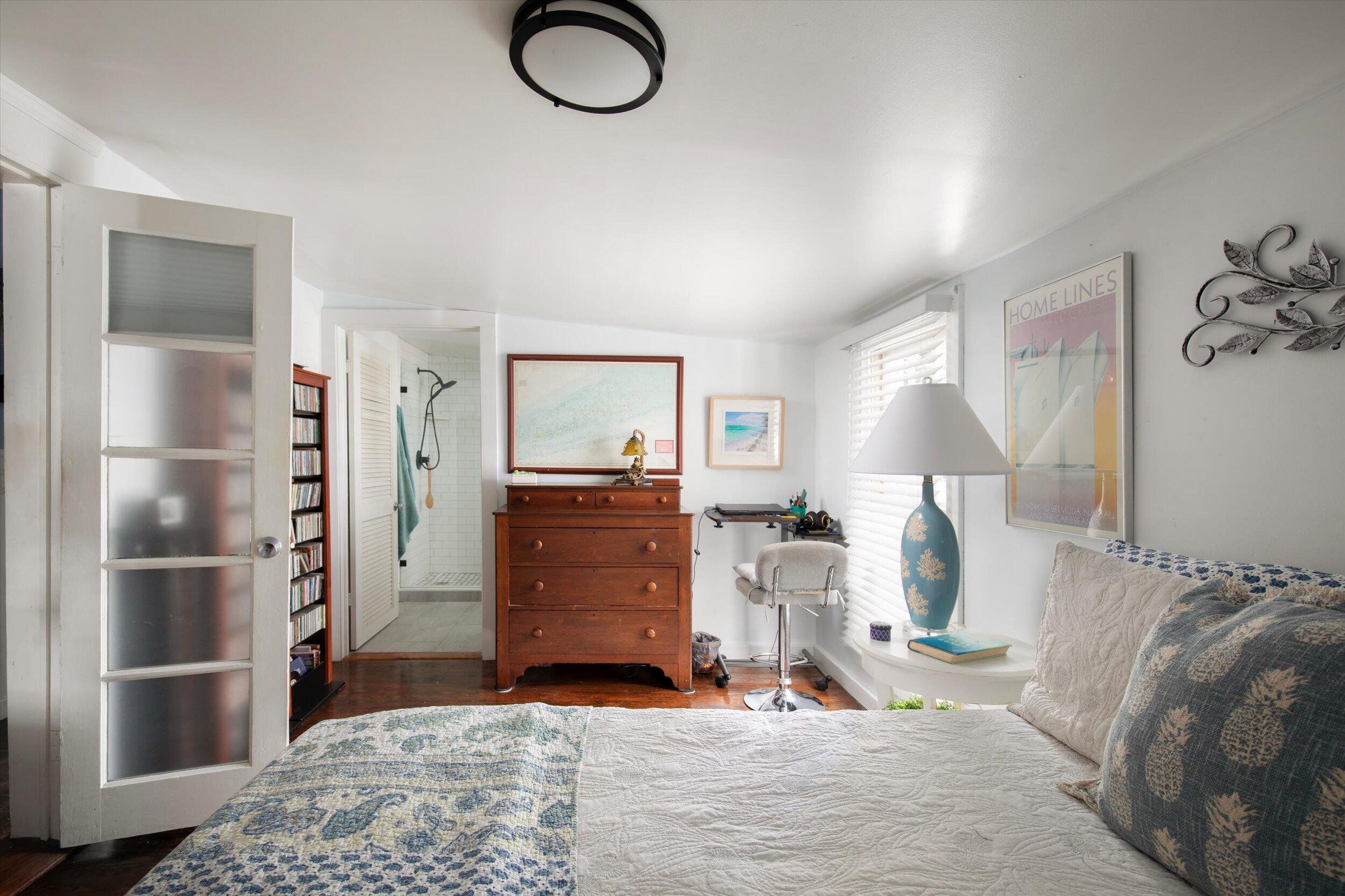 900 White Street, Unit 2 Key West, FL 33040 - Photo 13 of 24 a bedroom with a bed and a mirror