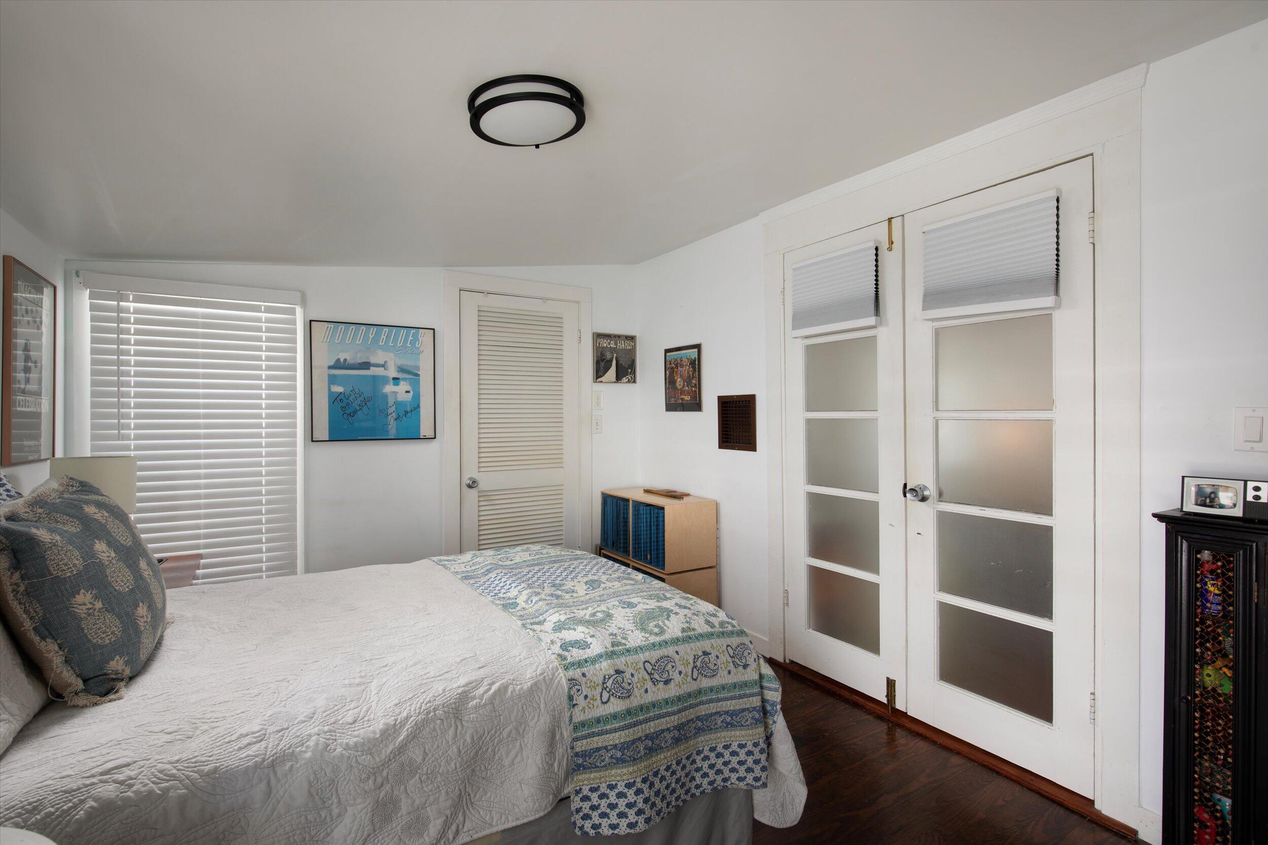 900 White Street, Unit 2 Key West, FL 33040 - Photo 14 of 24 a bedroom with a bed and a window