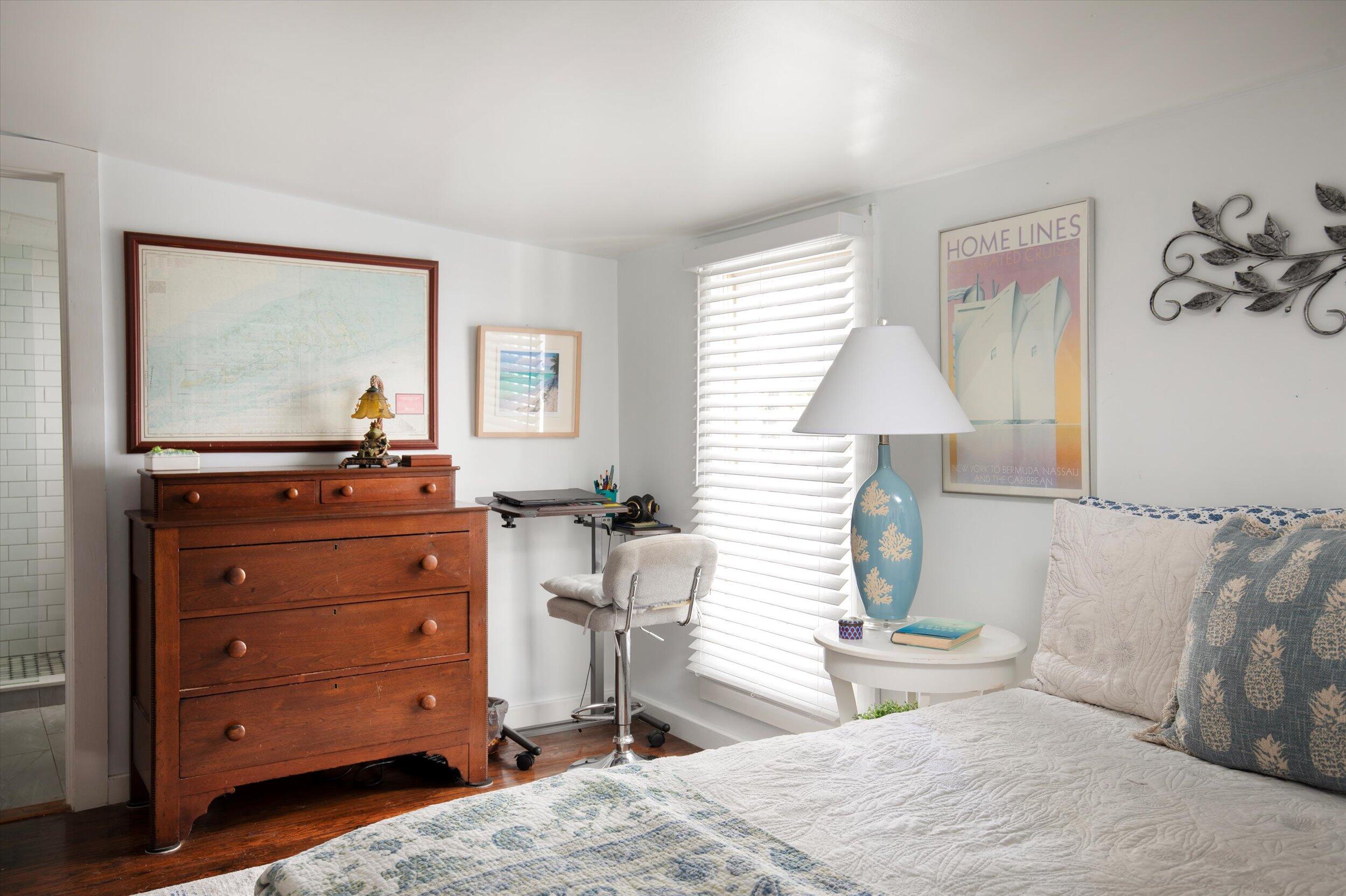 900 White Street, Unit 2 Key West, FL 33040 - Photo 15 of 24 a bedroom with a bed and a window