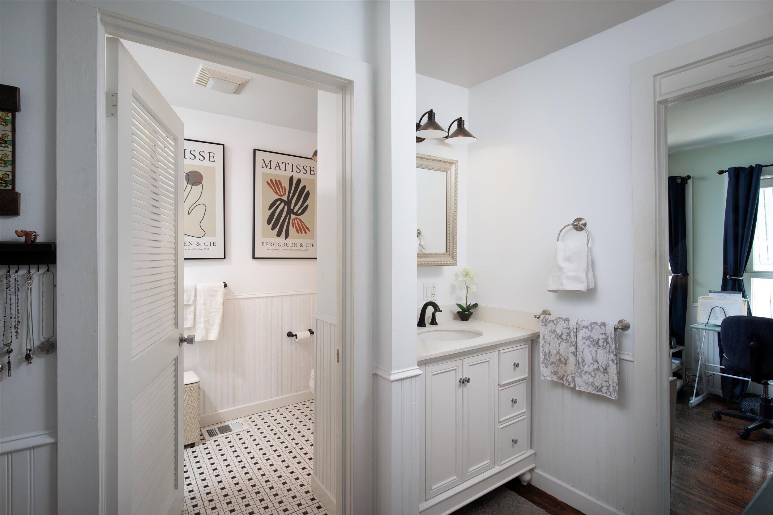 900 White Street, Unit 2 Key West, FL 33040 - Photo 16 of 24 a bathroom with a sink a mirror and shower
