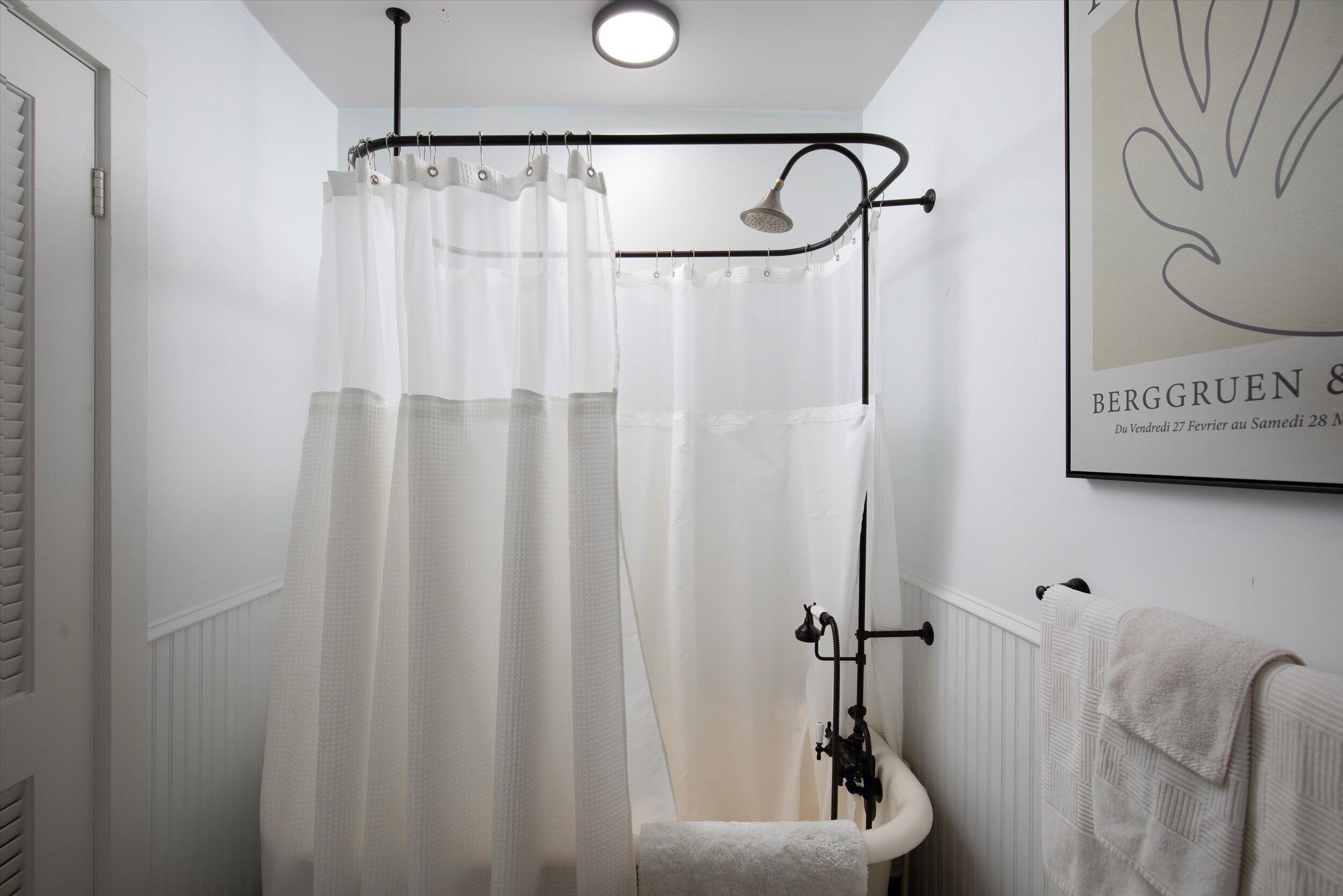 900 White Street, Unit 2 Key West, FL 33040 - Photo 17 of 24 a bathroom with a shower curtain and a shower
