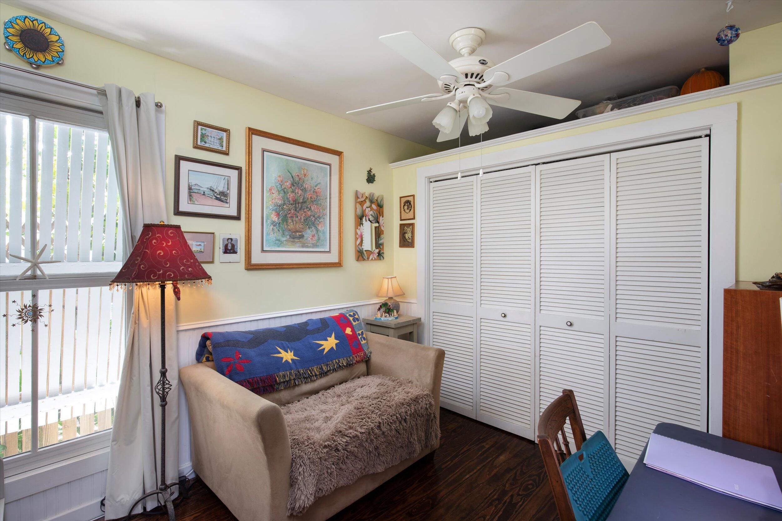 900 White Street, Unit 2 Key West, FL 33040 - Photo 18 of 24 a living room with furniture and a chandelier