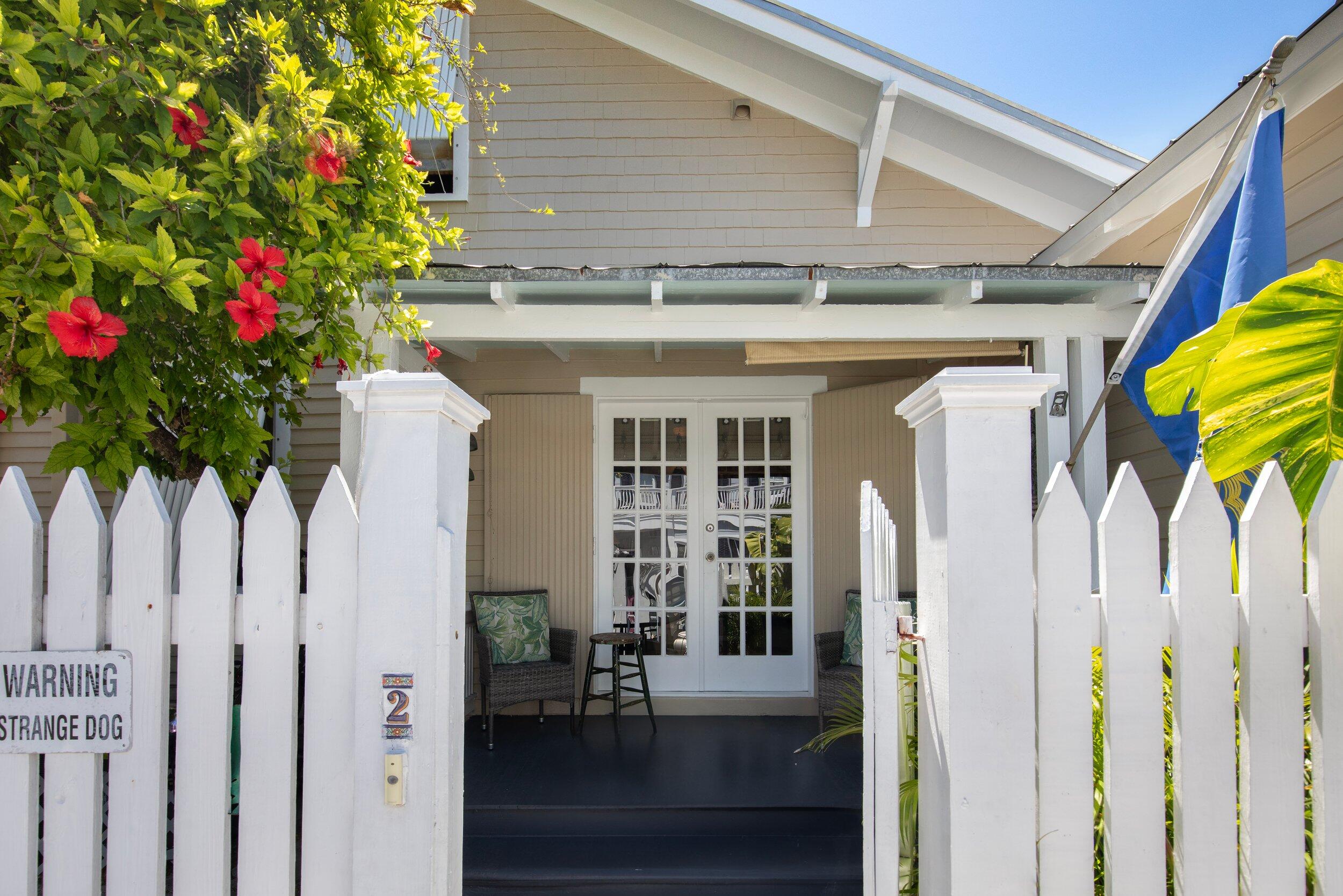 900 White Street, Unit 2 Key West, FL 33040 - Photo 20 of 24 a front view of a house with a porch