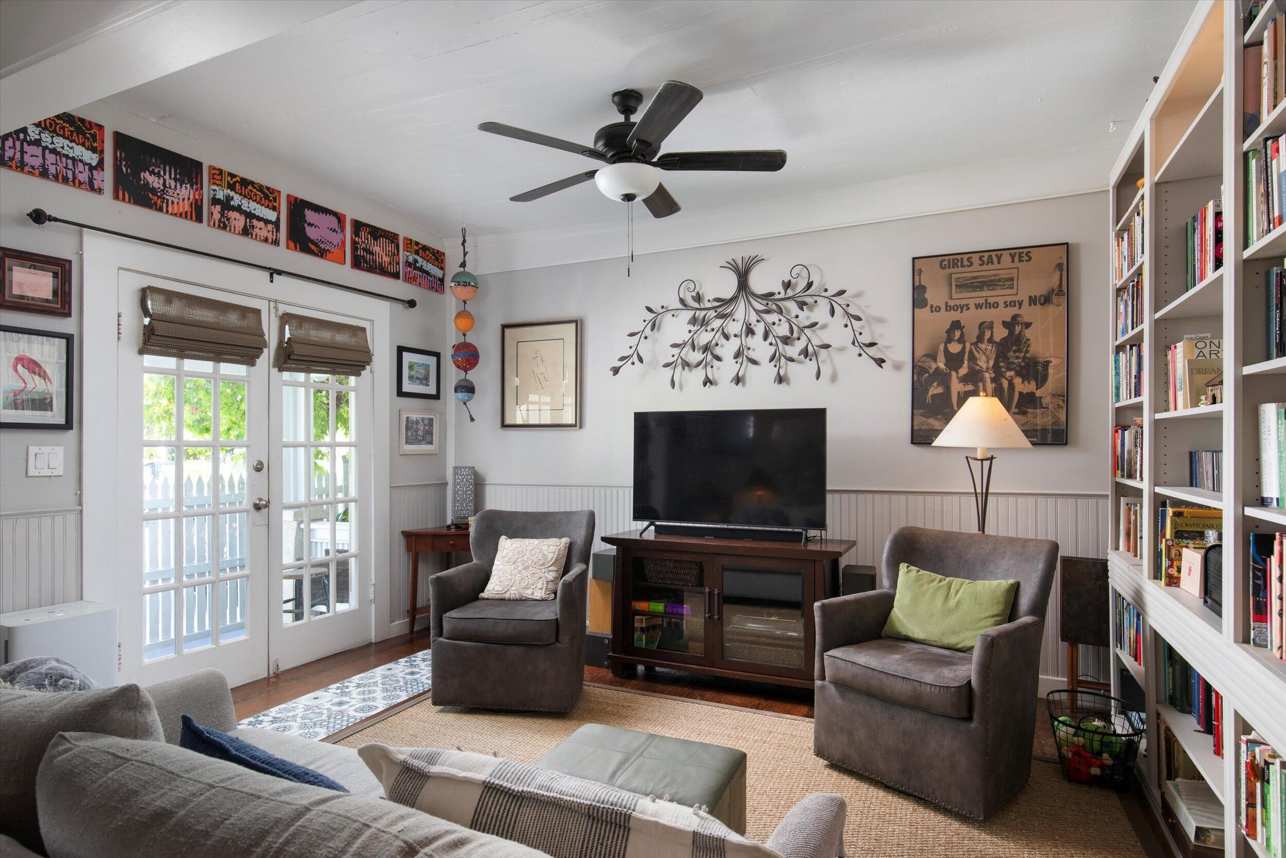 900 White Street, Unit 2 Key West, FL 33040 - Photo 2 of 24 a living room with furniture and a flat screen tv