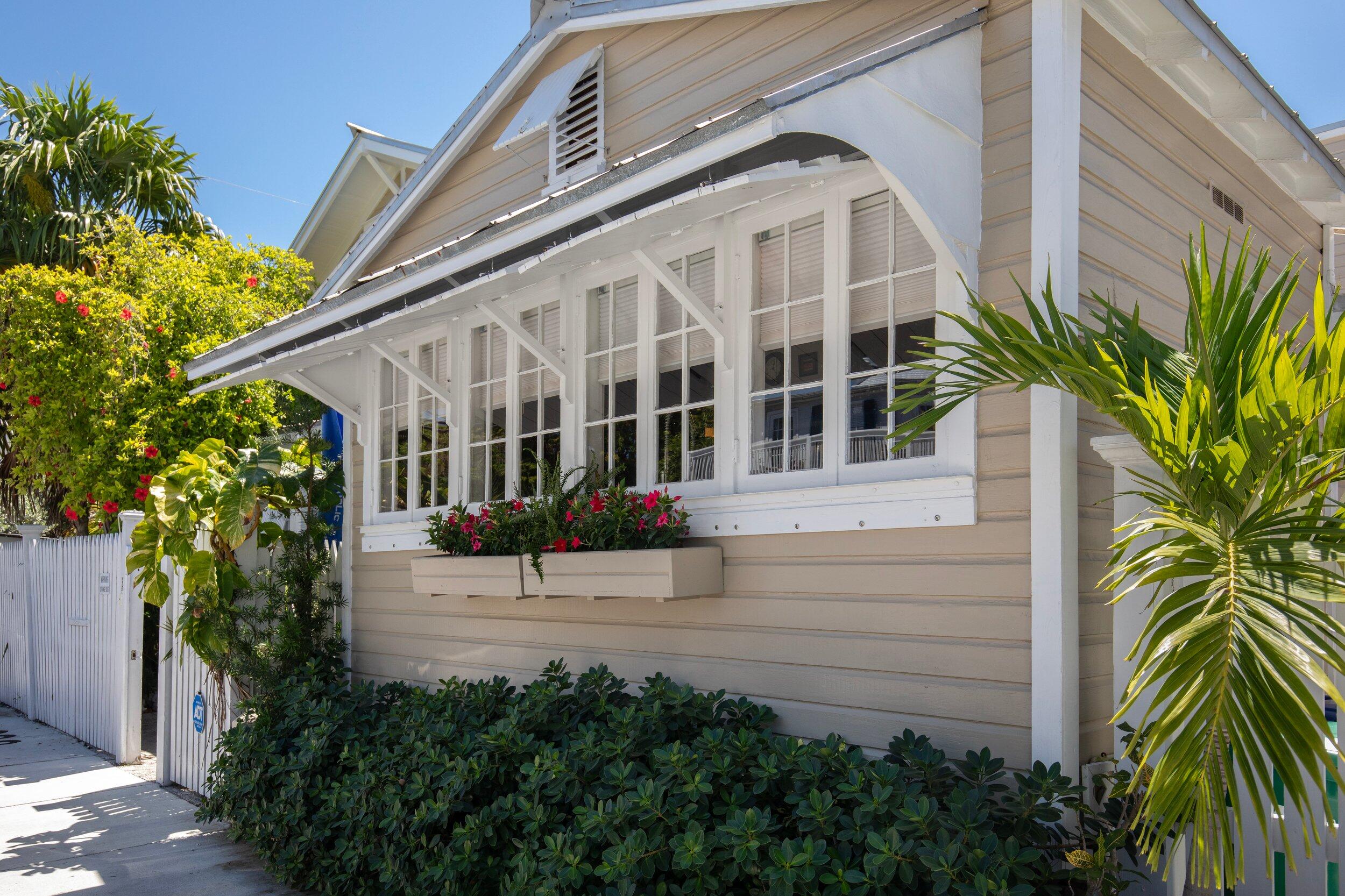 900 White Street, Unit 2 Key West, FL 33040 - Photo 22 of 24 a view of building with garden