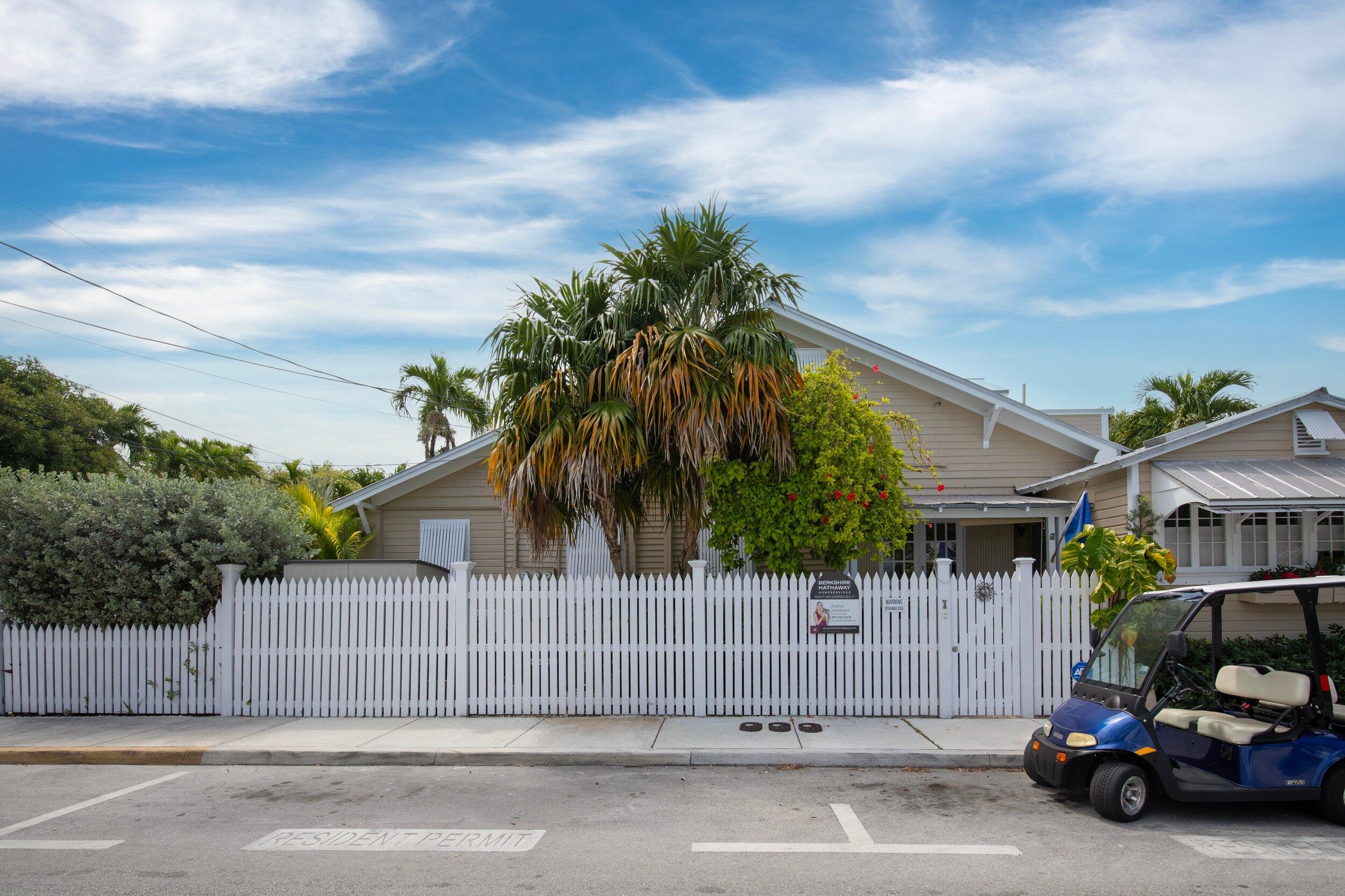 900 White Street, Unit 2 Key West, FL 33040 - Photo 24 of 24 a view of a car park in front of a house