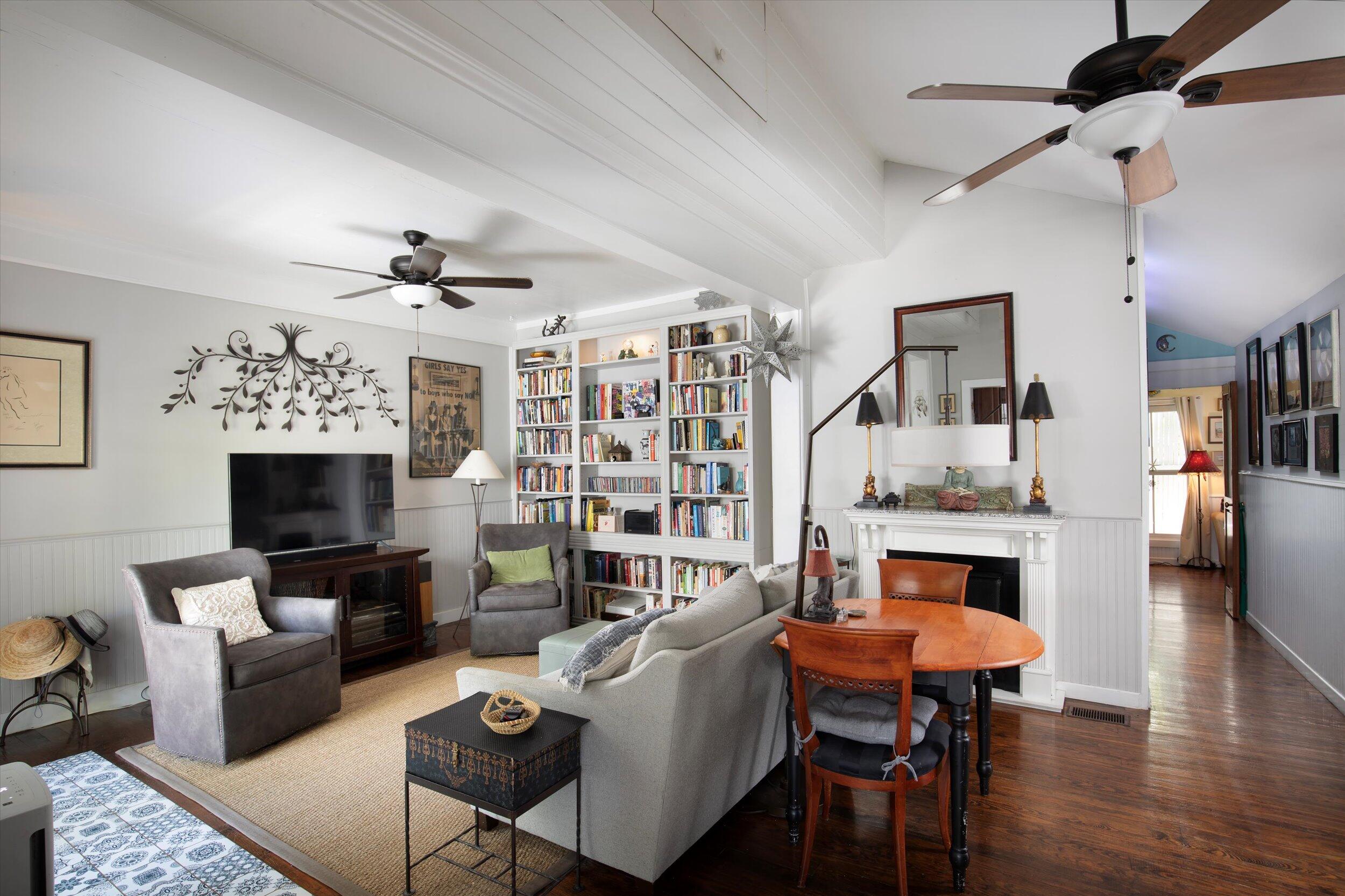 900 White Street, Unit 2 Key West, FL 33040 - Photo 6 of 24 a living room with furniture a fireplace and a flat screen tv