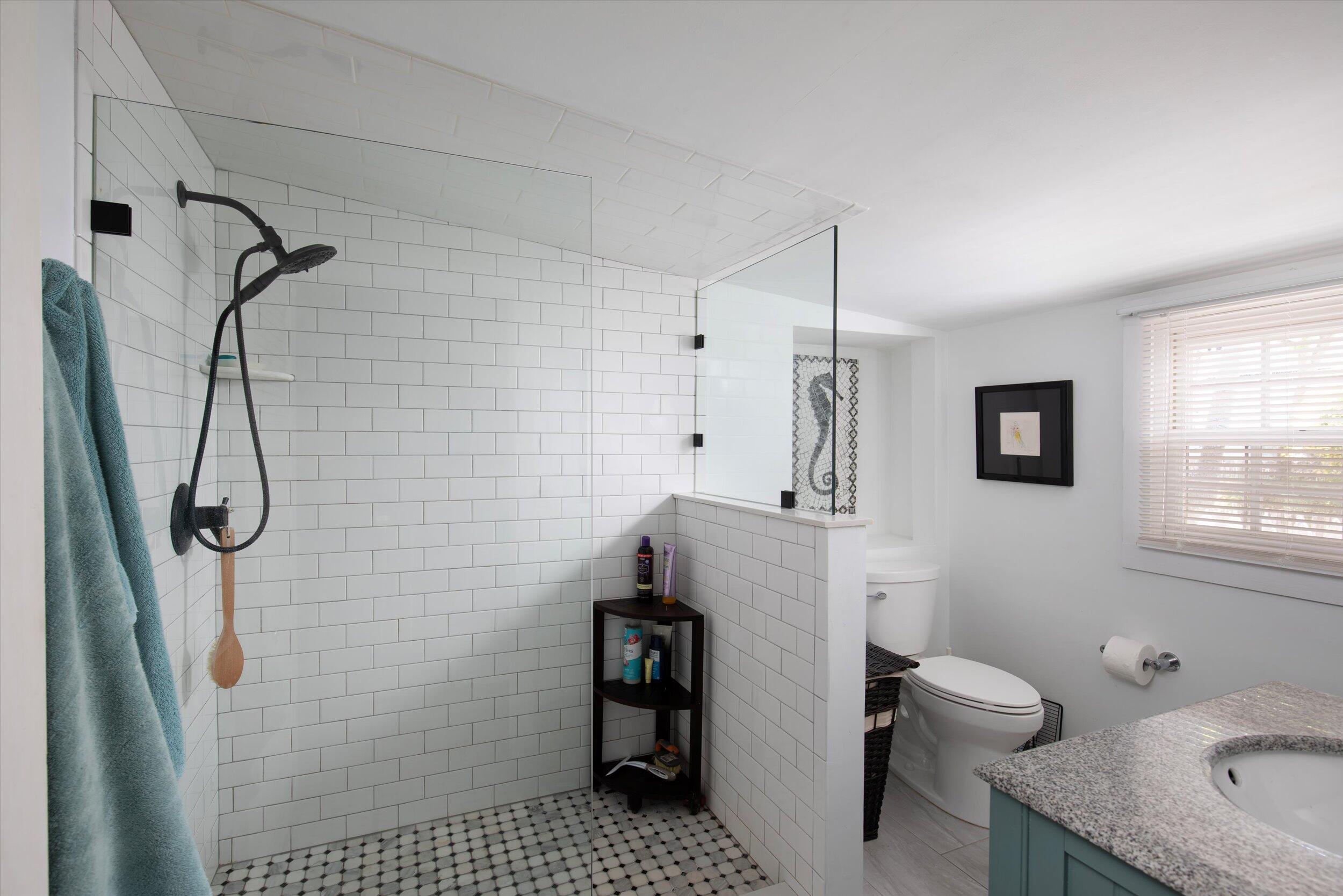 900 White Street, Unit 2 Key West, FL 33040 - Photo 10 of 24 a bathroom with a granite countertop shower and a toilet