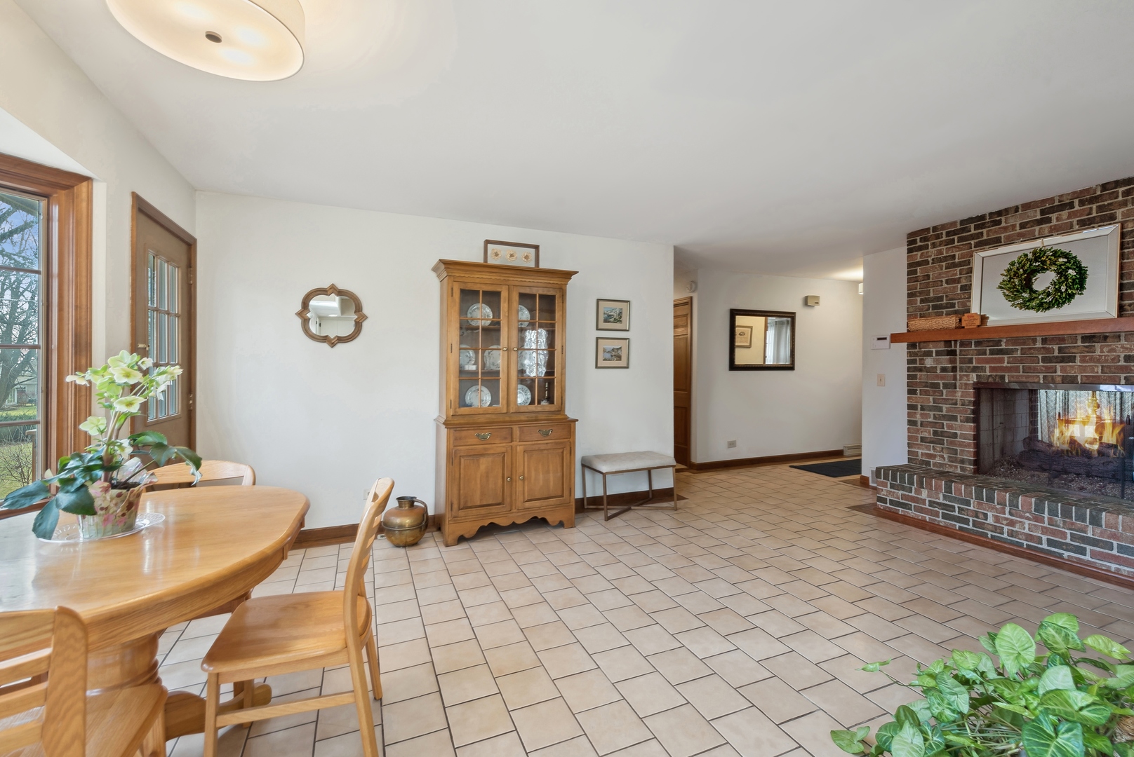 243 South Wulff Street Cary, IL 60013 - Photo 11 of 27 a living room with furniture a window and a fireplace