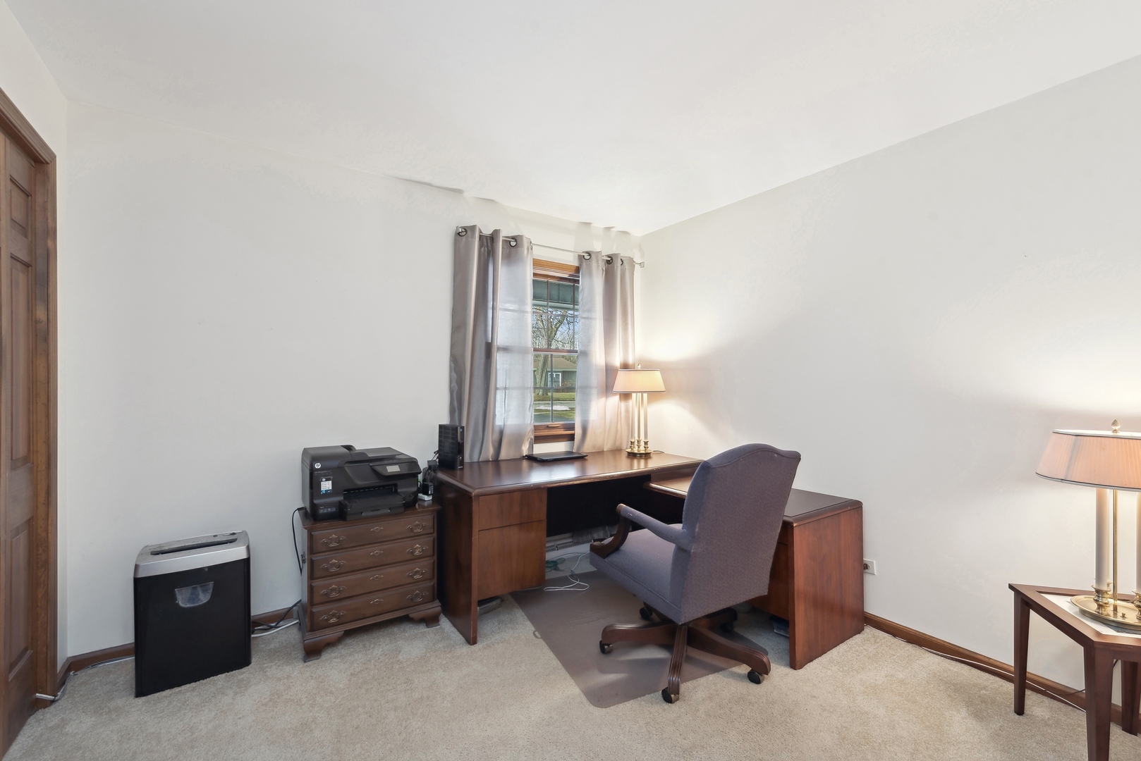 243 South Wulff Street Cary, IL 60013 - Photo 12 of 27 a view of a workspace with furniture and a window
