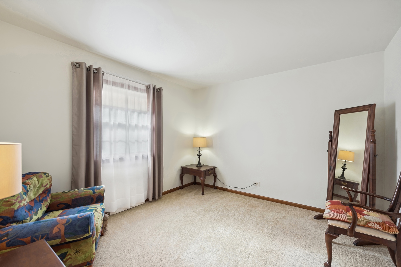 243 South Wulff Street Cary, IL 60013 - Photo 13 of 27 a room with furniture and a window
