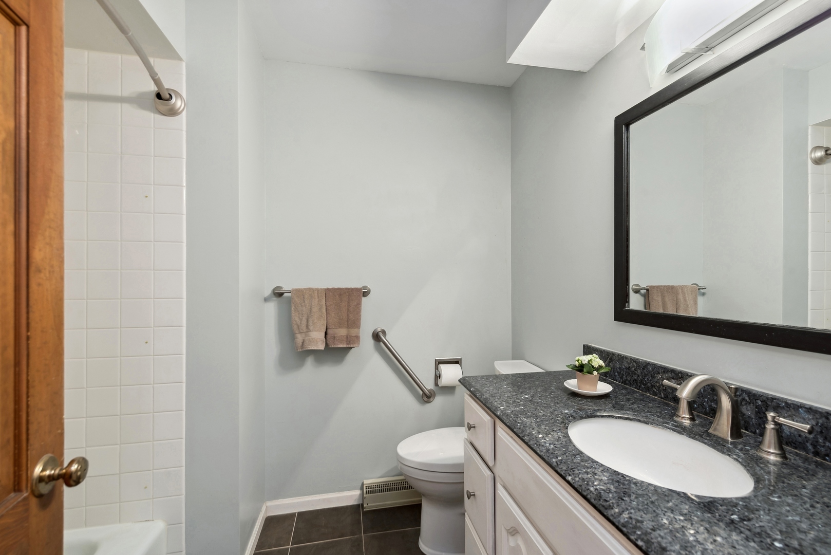 243 South Wulff Street Cary, IL 60013 - Photo 14 of 27 a bathroom with a granite countertop sink toilet and mirror