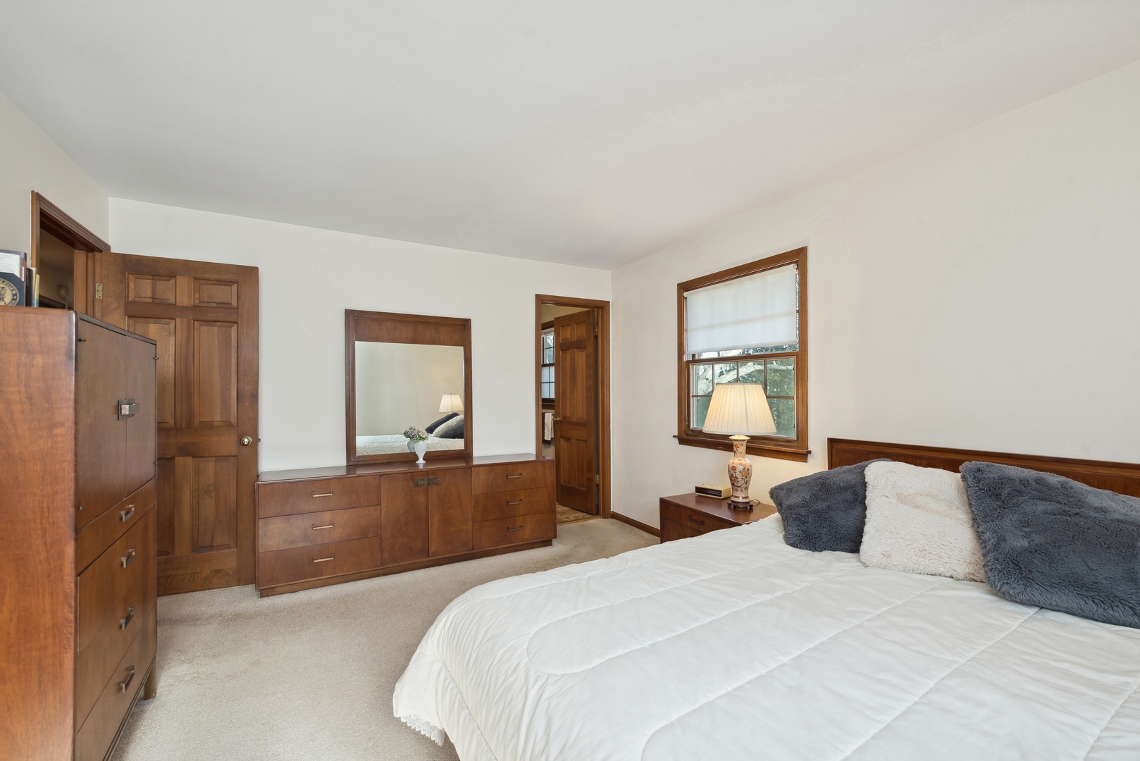 243 South Wulff Street Cary, IL 60013 - Photo 16 of 27 a bedroom with a bed and glass windows