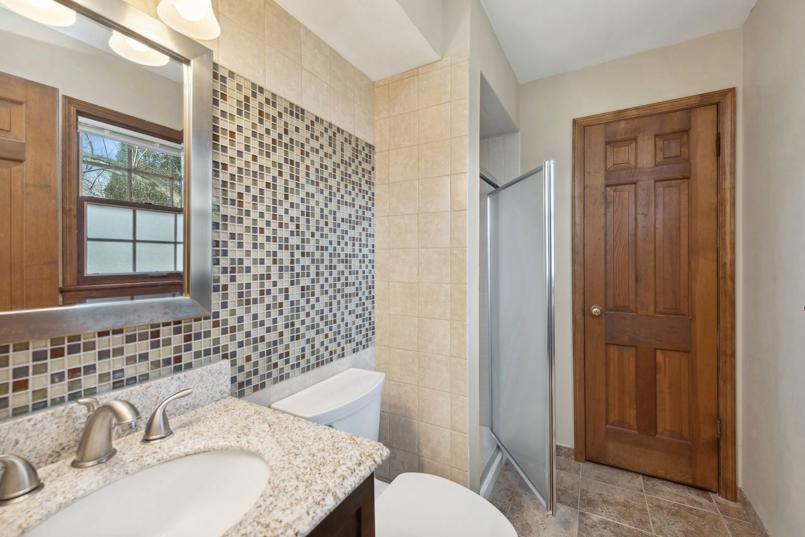243 South Wulff Street Cary, IL 60013 - Photo 17 of 27 a bathroom with a sink toilet and shower
