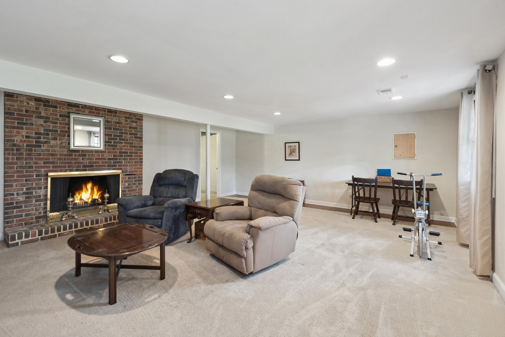 243 South Wulff Street Cary, IL 60013 - Photo 20 of 27 a living room with furniture and a fireplace