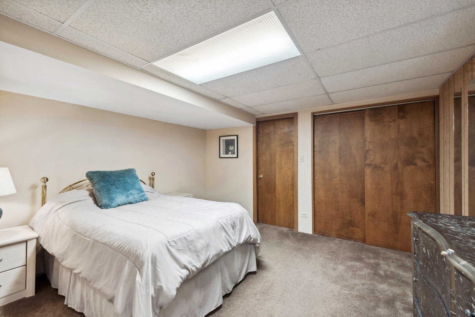 243 South Wulff Street Cary, IL 60013 - Photo 22 of 27 a bedroom with a large bed and a wooden door