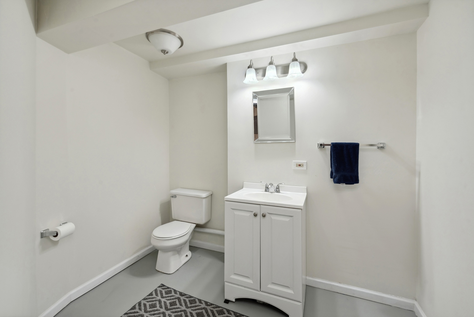 243 South Wulff Street Cary, IL 60013 - Photo 23 of 27 a bathroom with a toilet sink and mirror