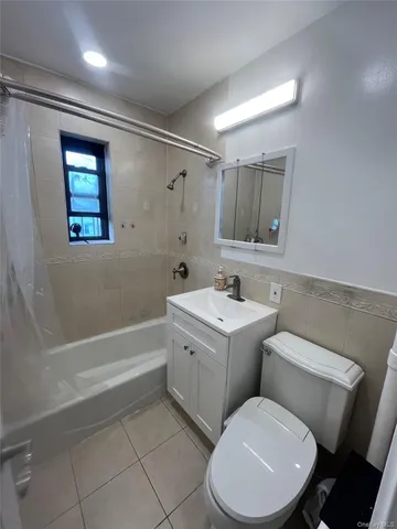 a bathroom with a toilet sink and bathtub