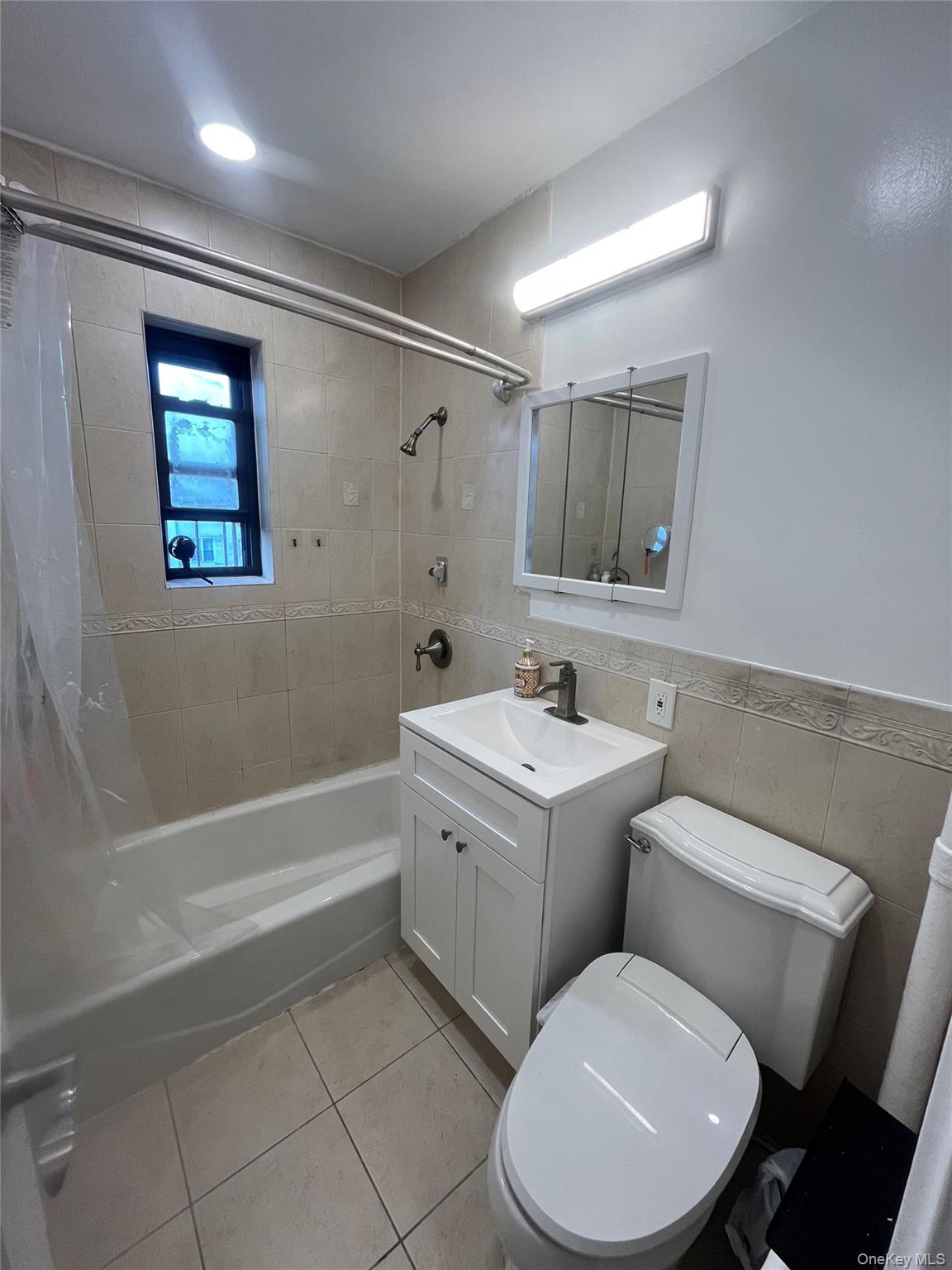 46-40 216th Street, Unit 3B Queens, NY 11361 - Photo 6 of 11 a bathroom with a toilet sink and bathtub