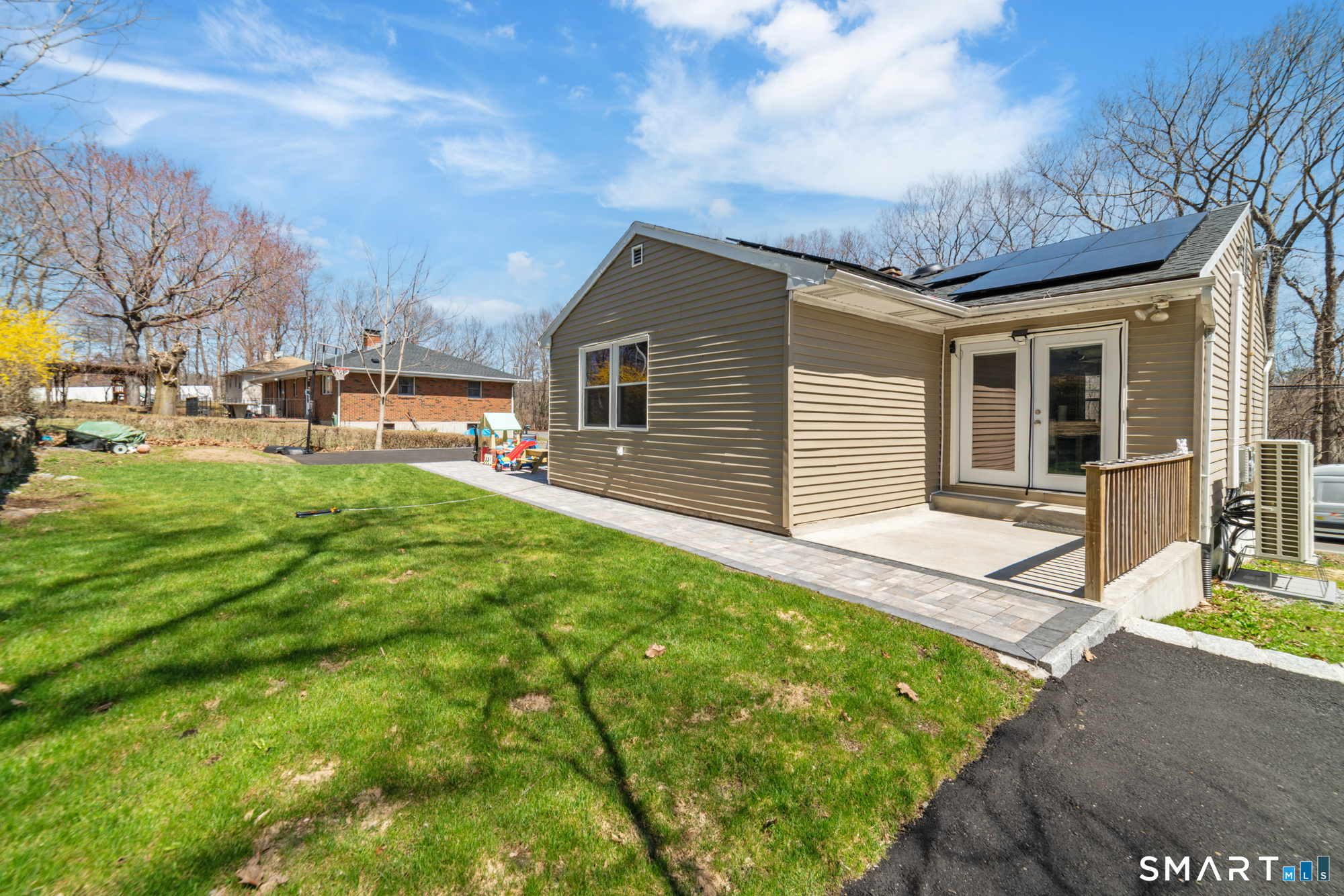 327 Lakeside Boulevard West Waterbury, CT 06708 - Photo 27 of 29 a front view of house with yard and trees in the background