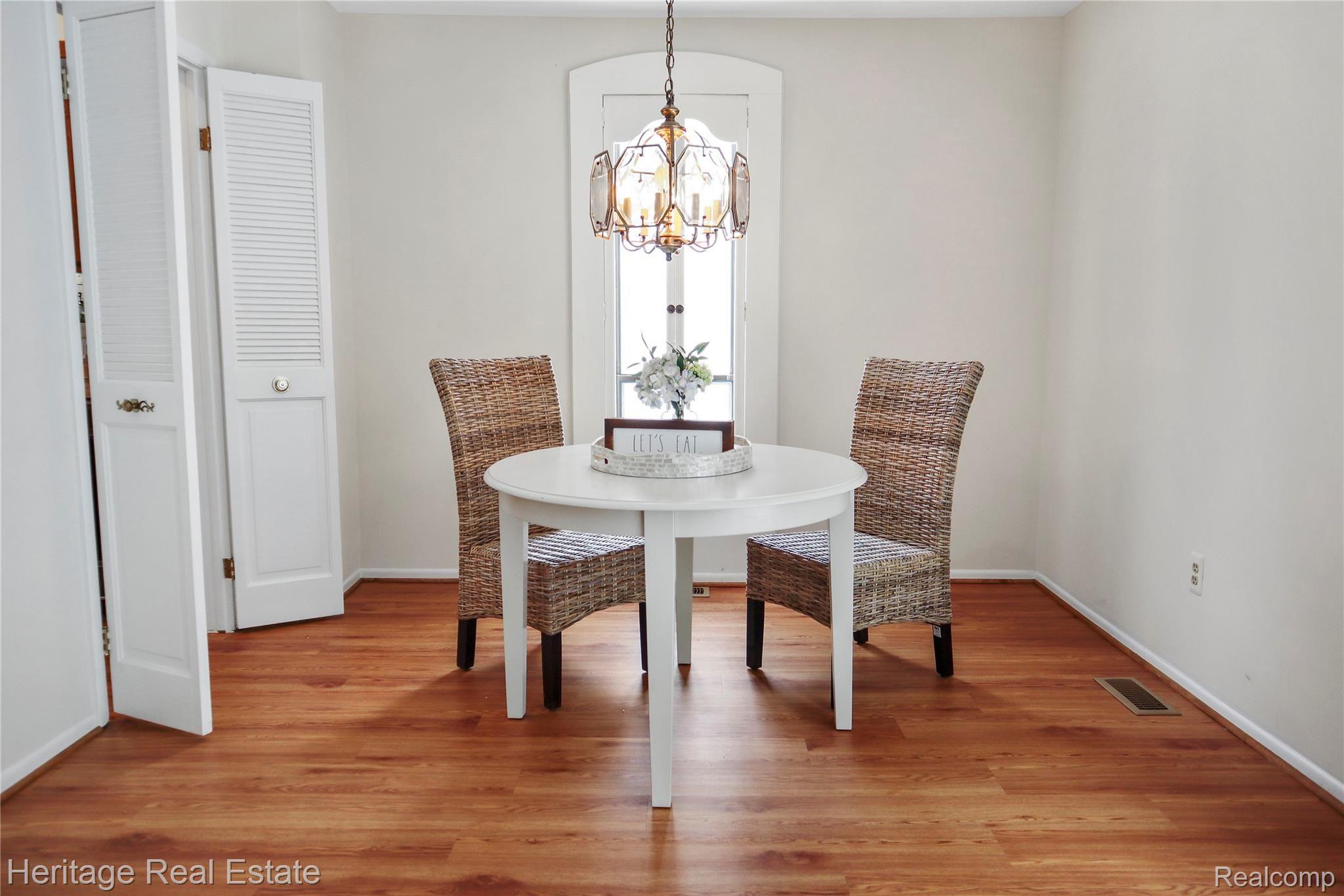 424 Willow Grove Lane Rochester, MI 48307 - Photo 13 of 20 Dining room is open to the living room area and has nice views of the backyard