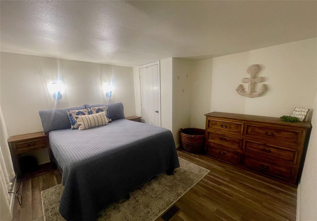 2334 San Bar Road, Unit 104 Graford, TX 76449 - Photo 8 of 31 Master bedroom at the end of the hallway