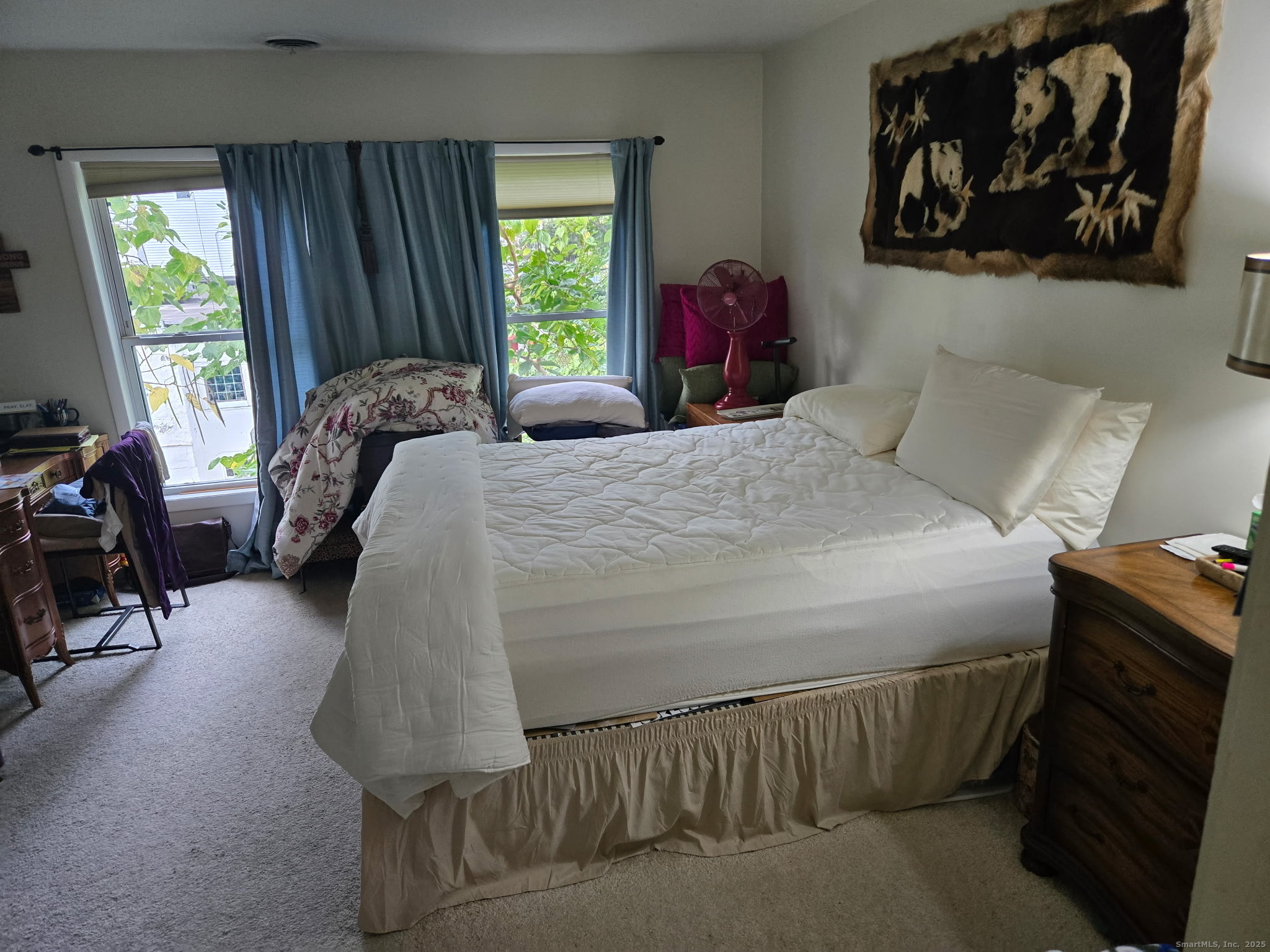 93 Spruce Street, Unit 11 Stamford, CT 06902 - Photo 3 of 6 a bed sitting in a bedroom next to a window