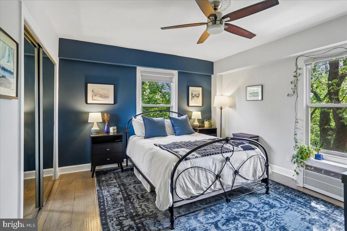 2500 Q Street Northwest, Unit 605 Washington, DC 20007 - Photo 15 of 48 a bedroom with a bed and a chandelier