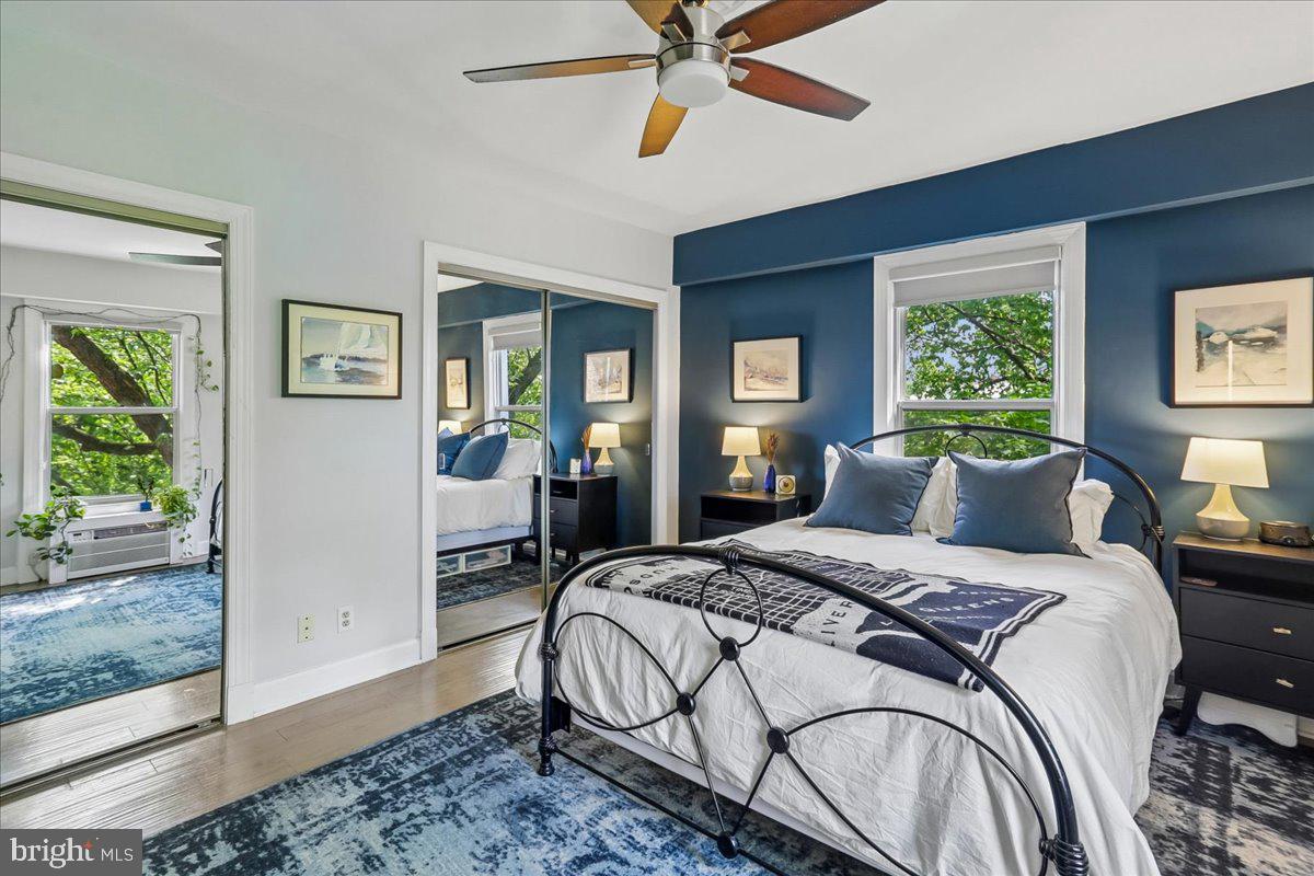 2500 Q Street Northwest, Unit 605 Washington, DC 20007 - Photo 16 of 48 a bedroom with a bed and a chandelier
