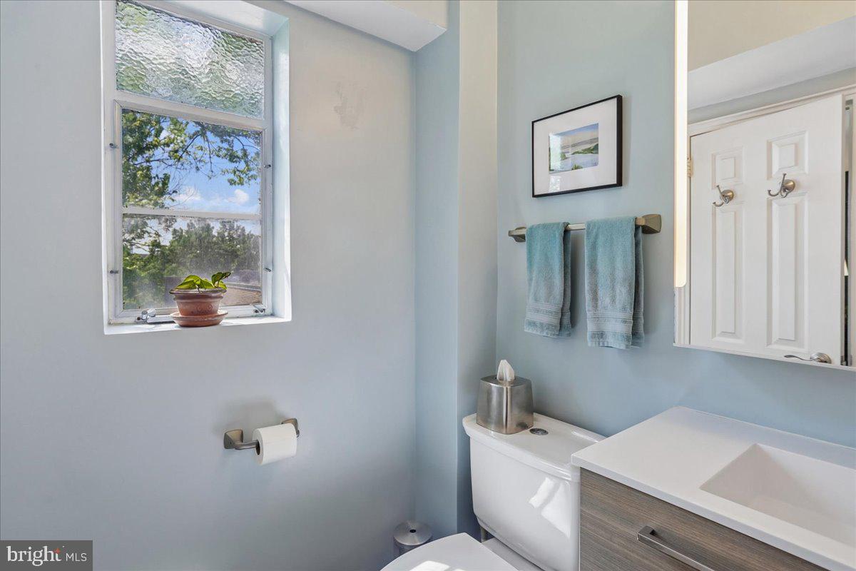 2500 Q Street Northwest, Unit 605 Washington, DC 20007 - Photo 20 of 48 a bathroom with a toilet a sink and a window