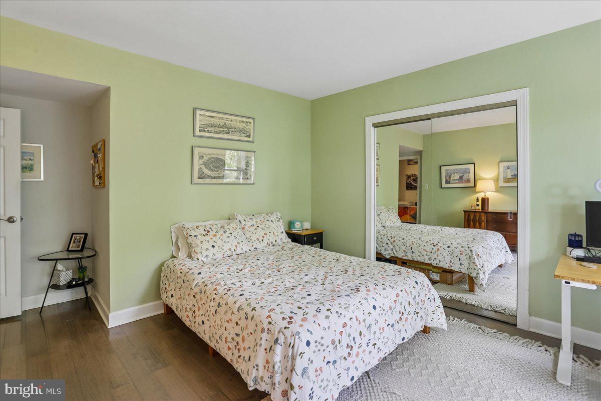 2500 Q Street Northwest, Unit 605 Washington, DC 20007 - Photo 24 of 48 a bedroom with a bed and a table in it
