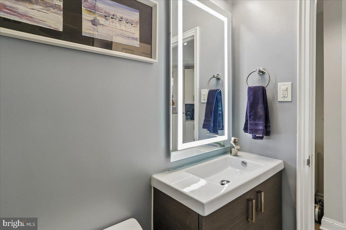 2500 Q Street Northwest, Unit 605 Washington, DC 20007 - Photo 25 of 48 a bathroom with a sink and a mirror