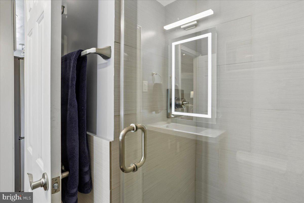 2500 Q Street Northwest, Unit 605 Washington, DC 20007 - Photo 26 of 48 a bathroom with a shower