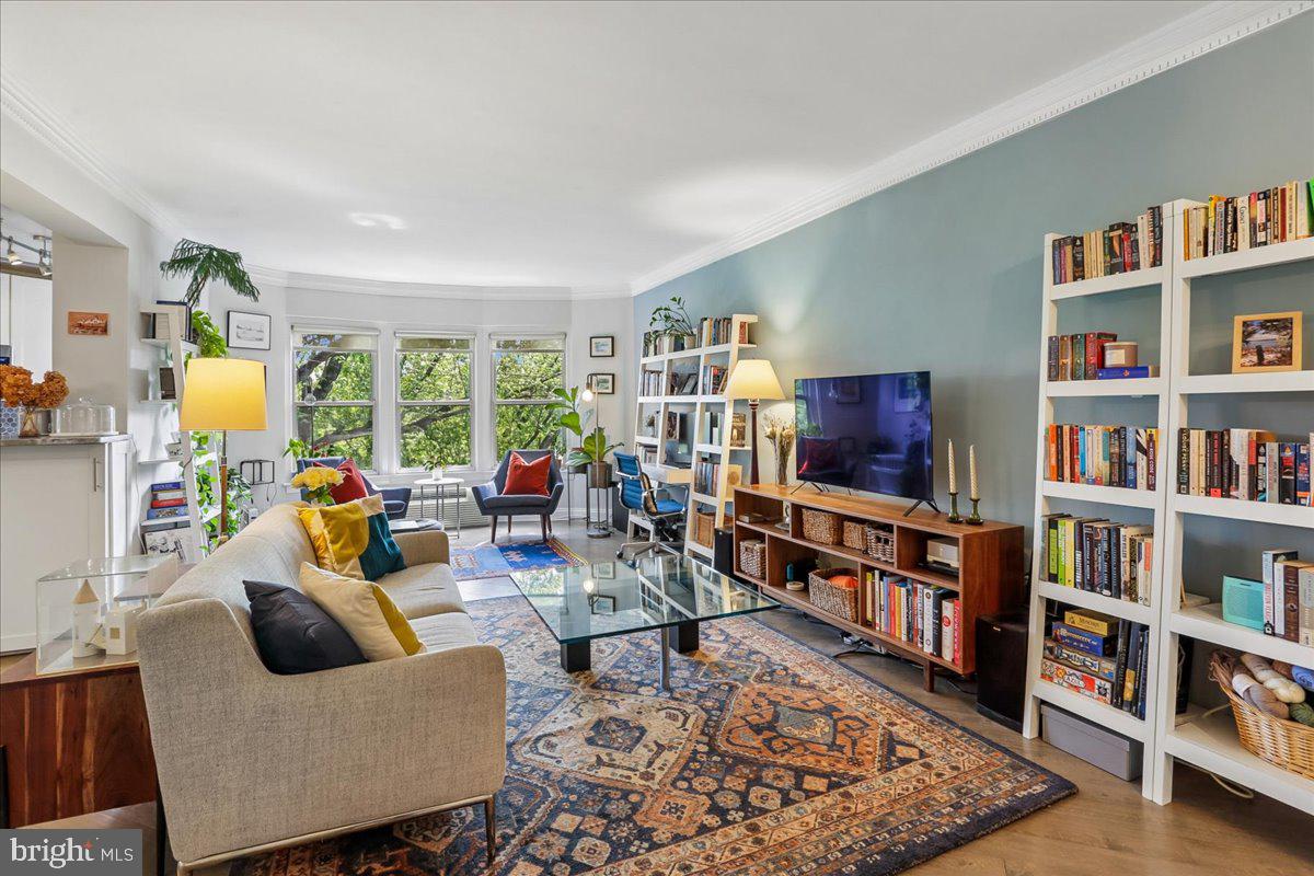 2500 Q Street Northwest, Unit 605 Washington, DC 20007 - Photo 3 of 48 a living room with furniture and a book shelf