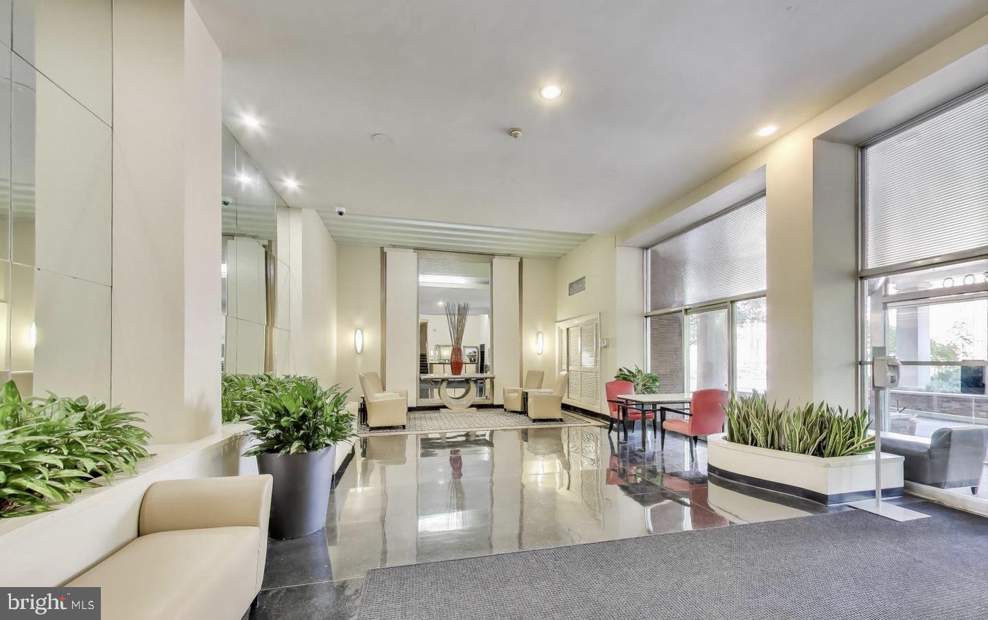 2500 Q Street Northwest, Unit 605 Washington, DC 20007 - Photo 37 of 48 a lobby with furniture and a potted plant