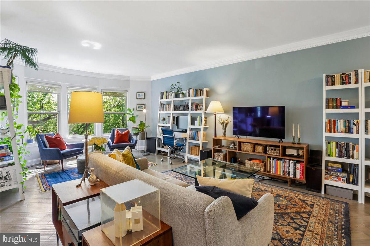 2500 Q Street Northwest, Unit 605 Washington, DC 20007 - Photo 5 of 48 a living room with furniture and a flat screen tv
