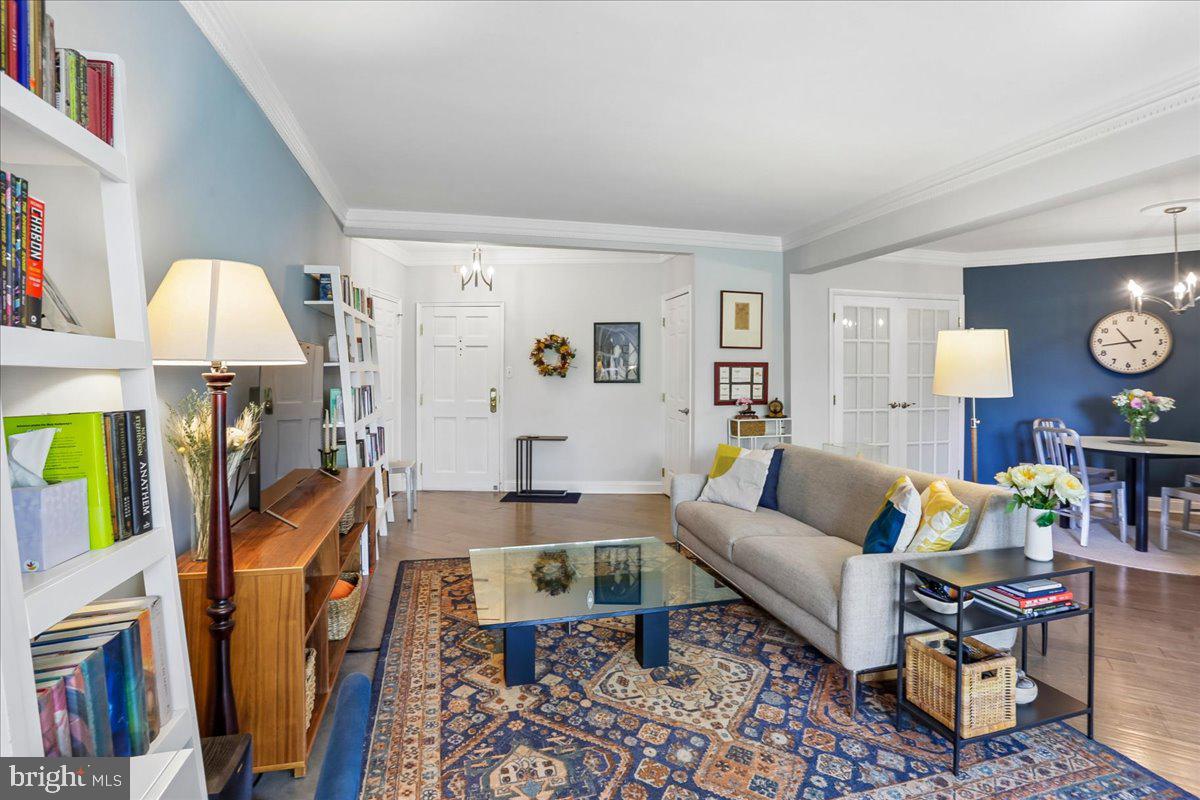2500 Q Street Northwest, Unit 605 Washington, DC 20007 - Photo 7 of 48 a living room with furniture a rug and a flat screen tv