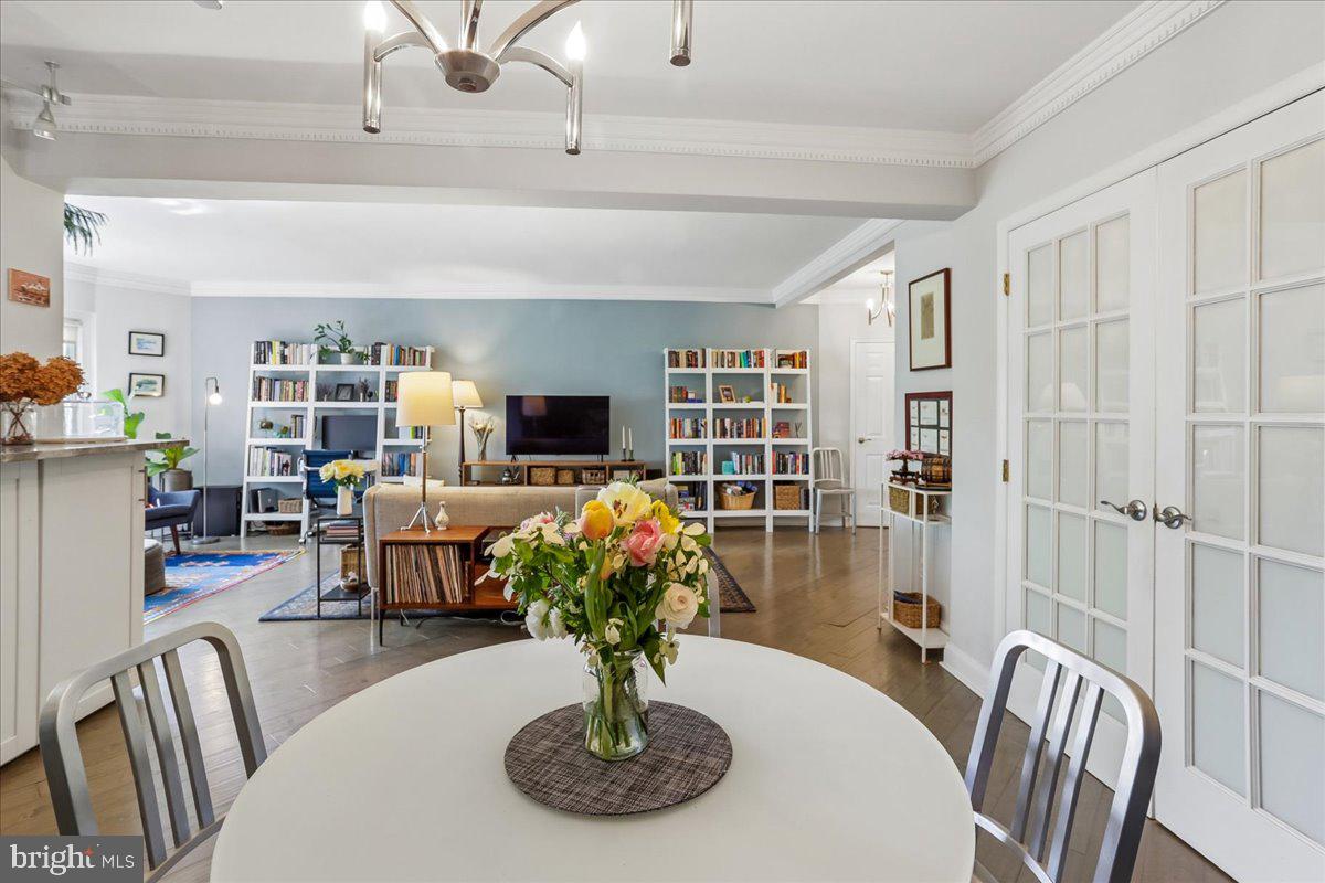2500 Q Street Northwest, Unit 605 Washington, DC 20007 - Photo 9 of 48 a dining room with furniture a rug and wooden floor