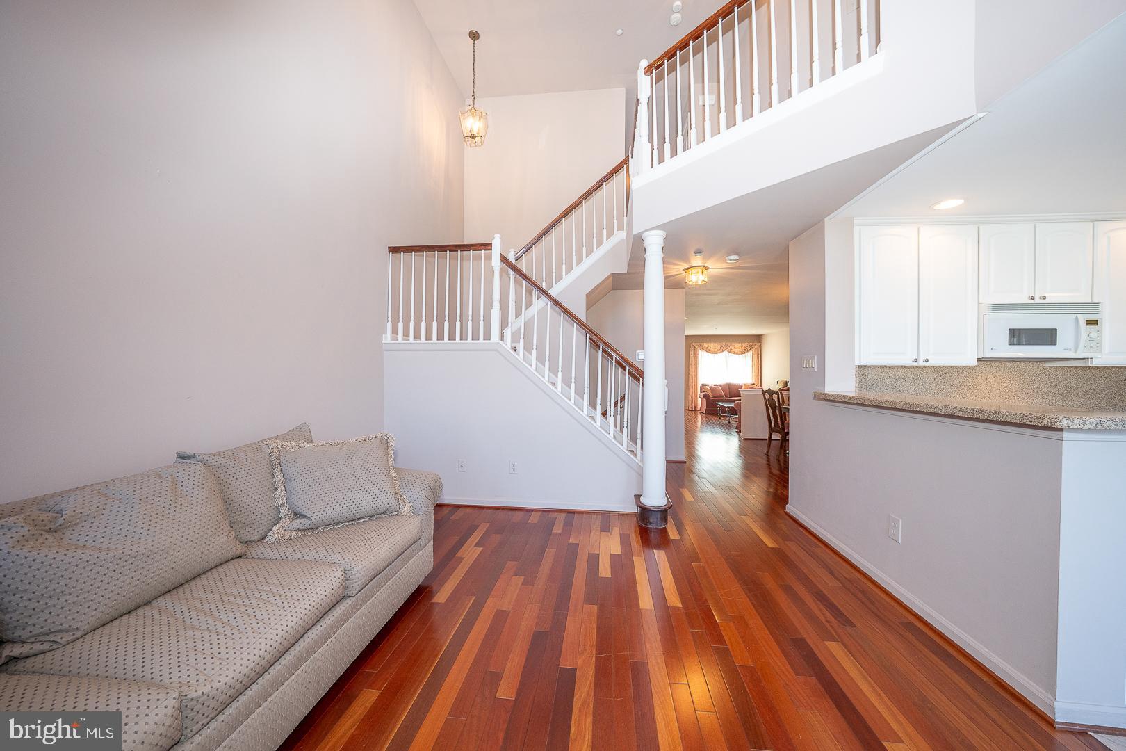 234 Lookout Place Wayne, PA 19087 - Photo 12 of 32 a living room with stairs and a wooden floor